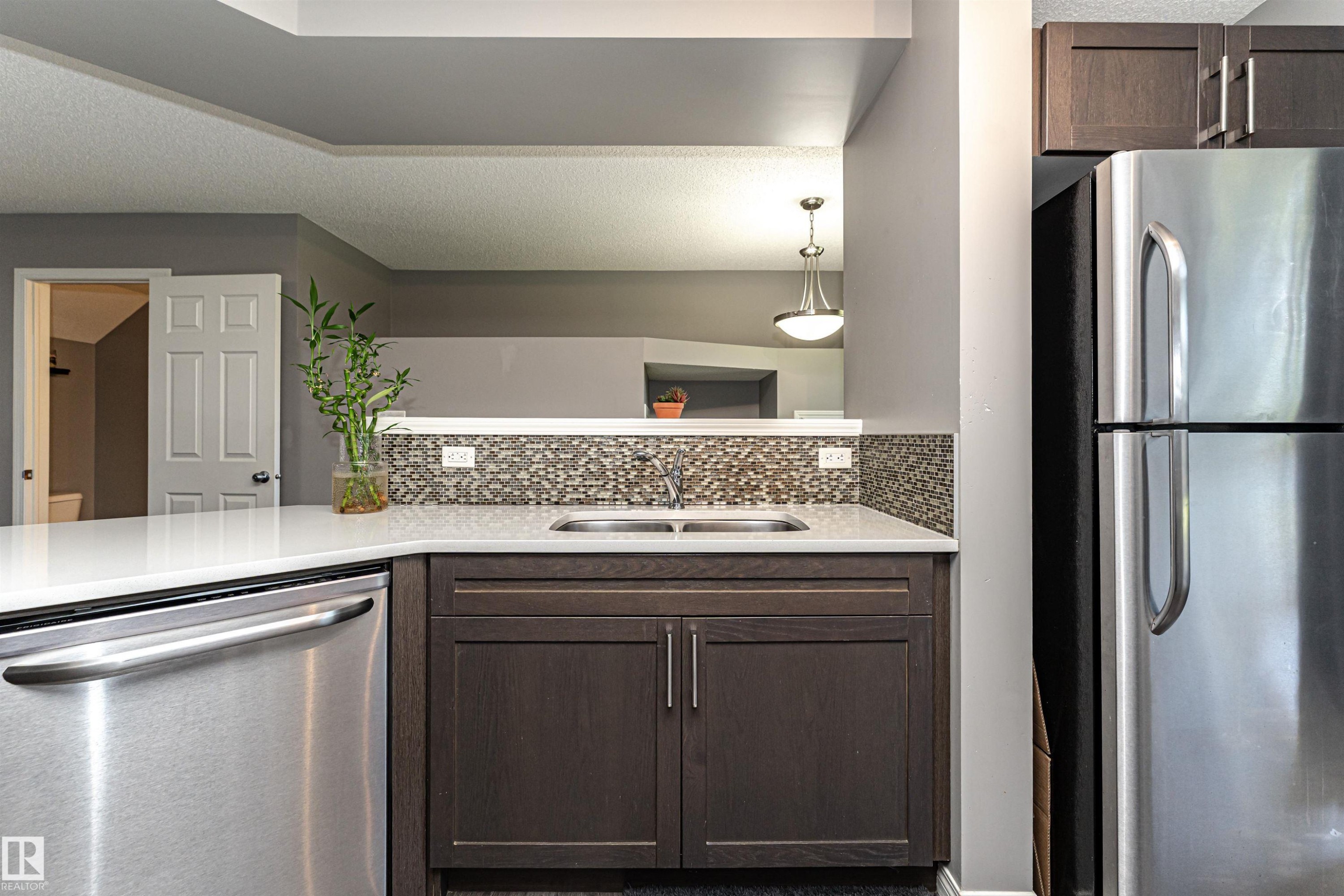 #22 4029 Orchards Dr Sw, Edmonton, AB - Indoor Photo Showing Kitchen With Double Sink