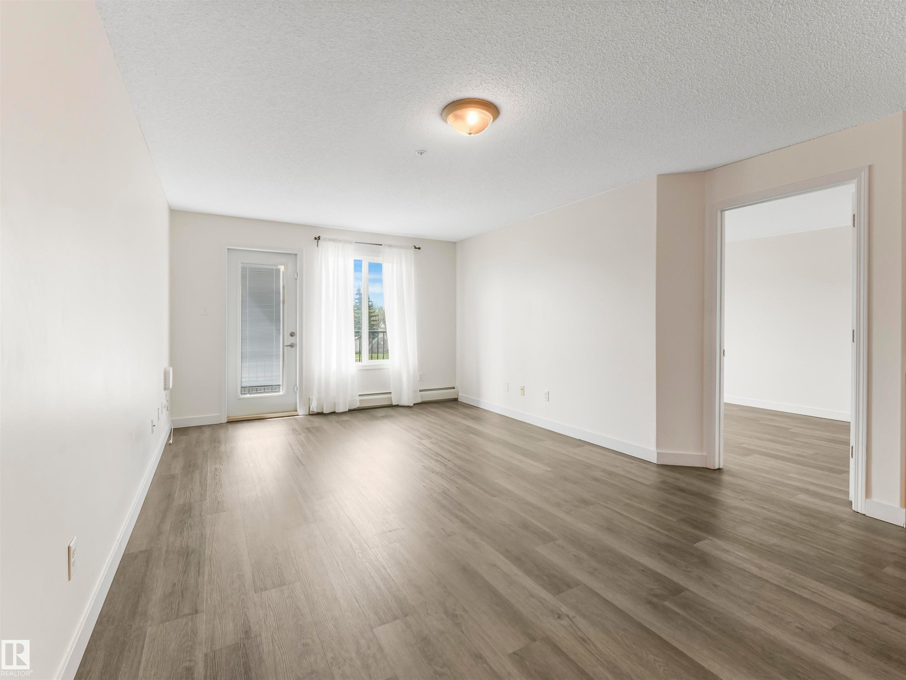 #216 111 Edwards Dr Sw, Edmonton, AB - Indoor Photo Showing Other Room