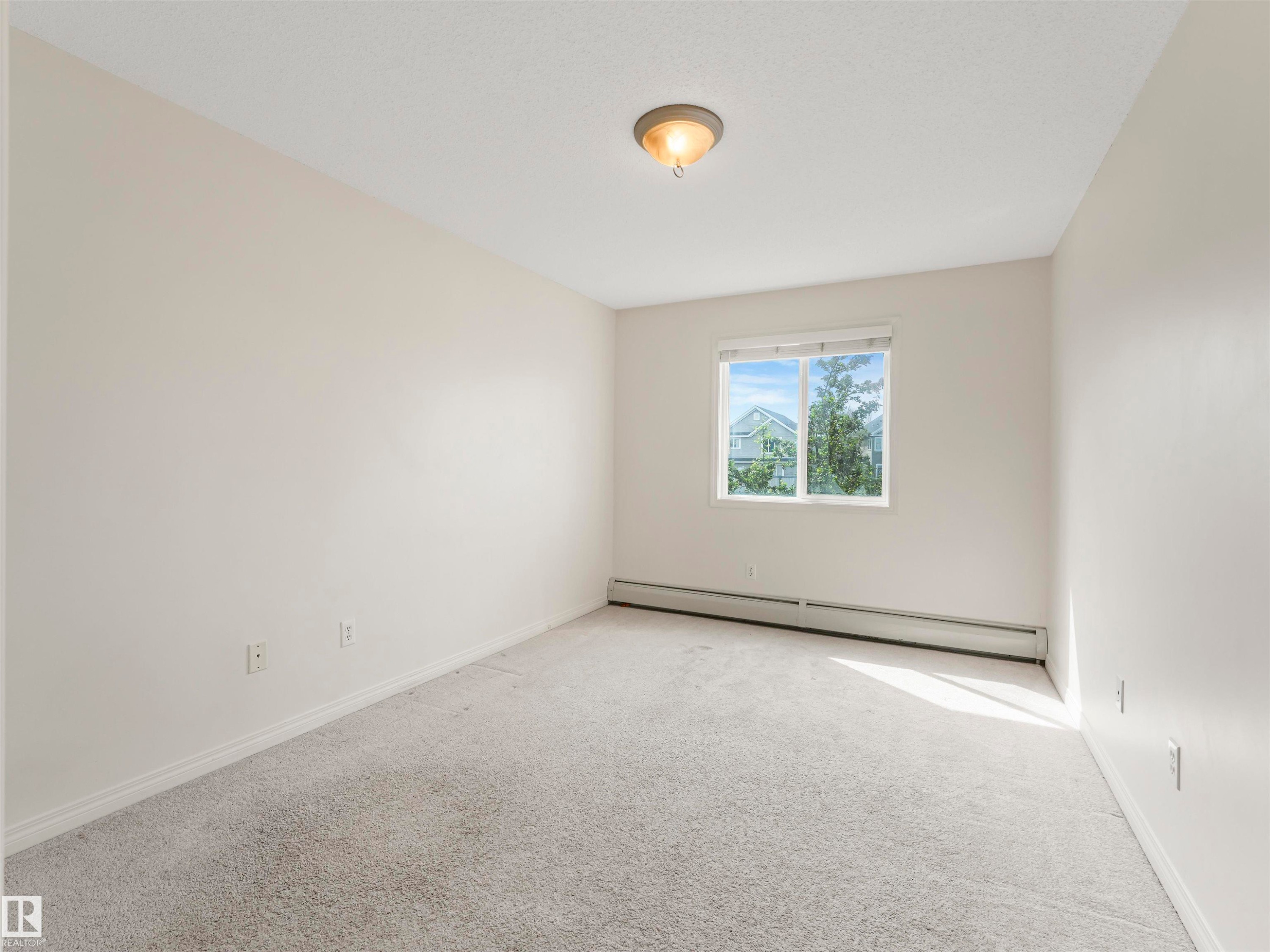 #216 111 Edwards Dr Sw, Edmonton, AB - Indoor Photo Showing Other Room