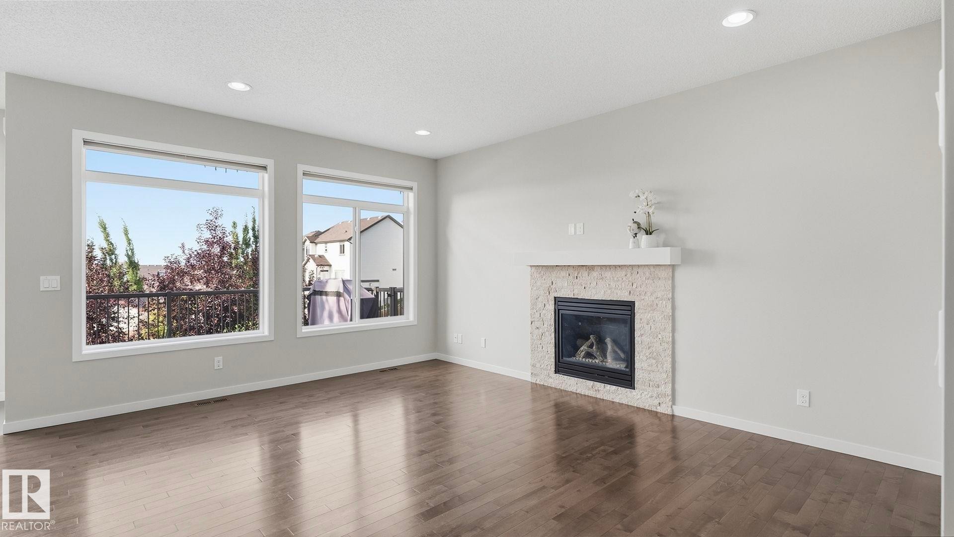 1832 56 Street Sw, Edmonton, AB - Indoor Photo Showing Living Room With Fireplace