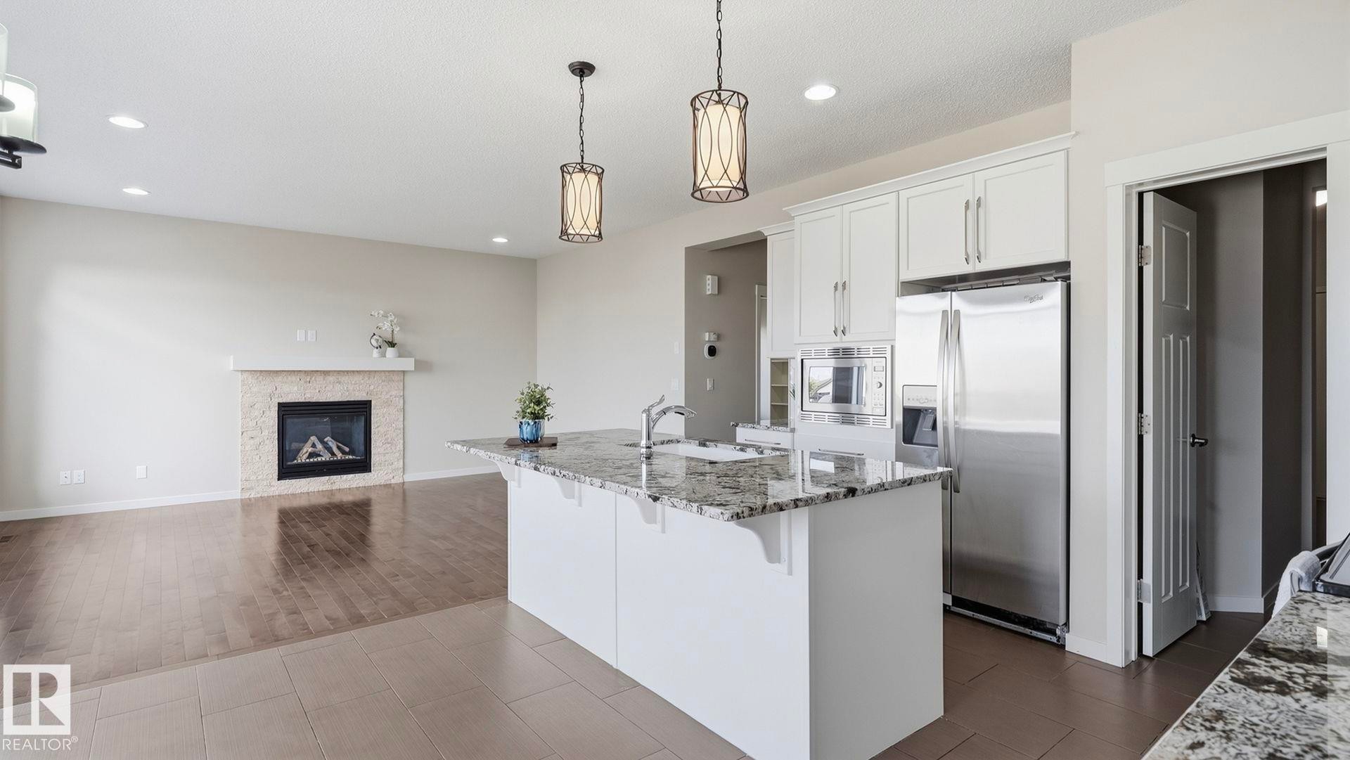 1832 56 Street Sw, Edmonton, AB - Indoor Photo Showing Kitchen With Fireplace With Upgraded Kitchen