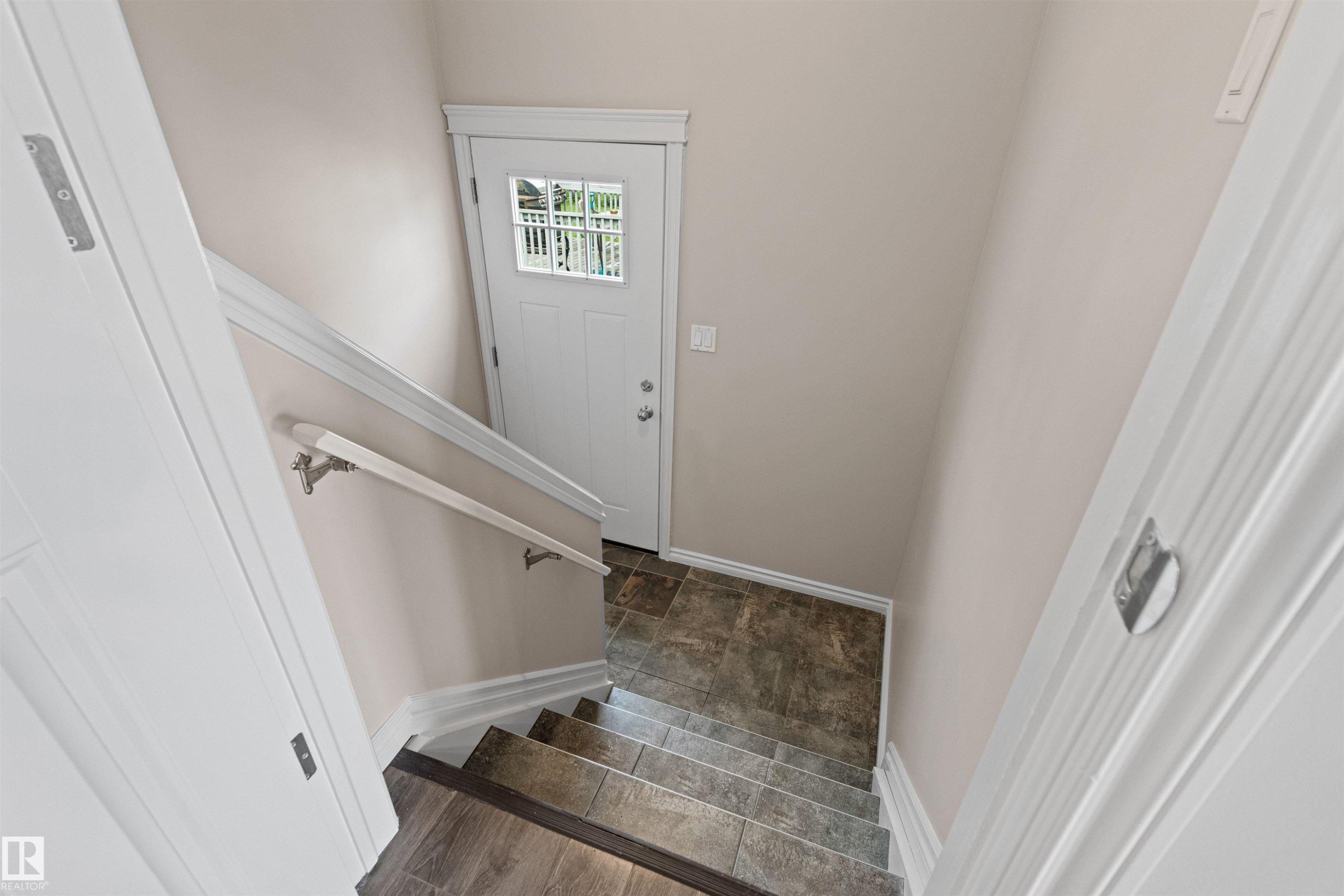 White paneled entry door with clear glass inserts - 10634 155 Street Nw, Edmonton, AB - Indoor Photo Showing Other Room