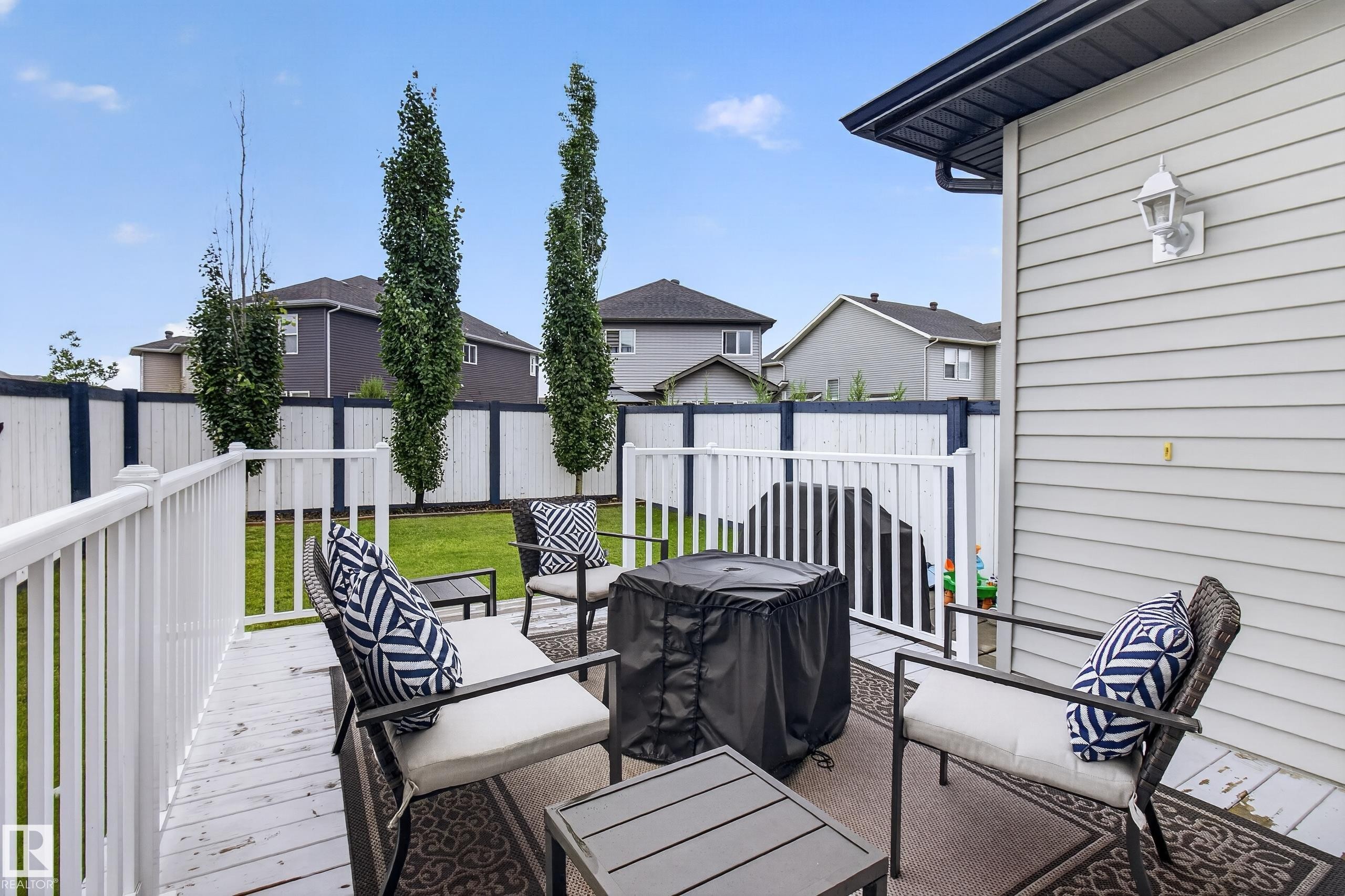 Outdoor deck area featuring white railing and a wooden deck surface - 17305 73 Street Nw, Edmonton, AB - Outdoor With Deck Patio Veranda With Exterior