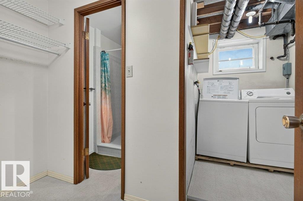 Laundry area featuring a window and exposed ceiling utilities - 9026 92 Street Nw, Edmonton, AB - Indoor Photo Showing Laundry Room