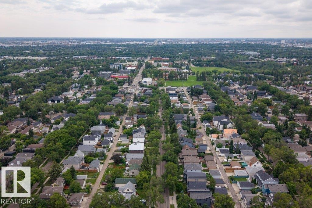 Aerial perspective of a residential neighborhood with tree-lined streets and varied architectural styles - 9026 92 Street Nw, Edmonton, AB - Outdoor With View