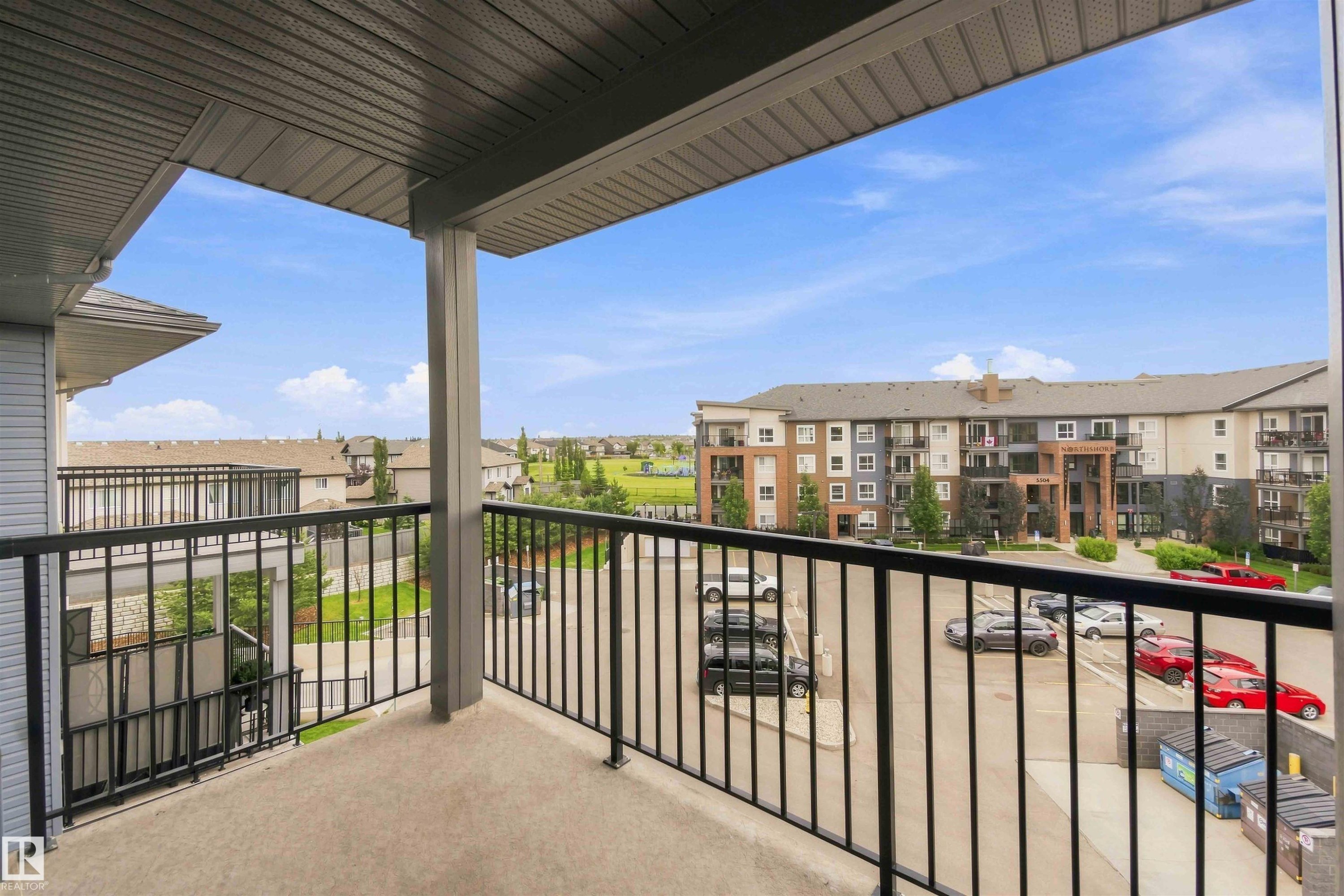 Private balcony featuring a concrete floor and black metal railing - #414 5510 Schonsee Dr Nw, Edmonton, AB
