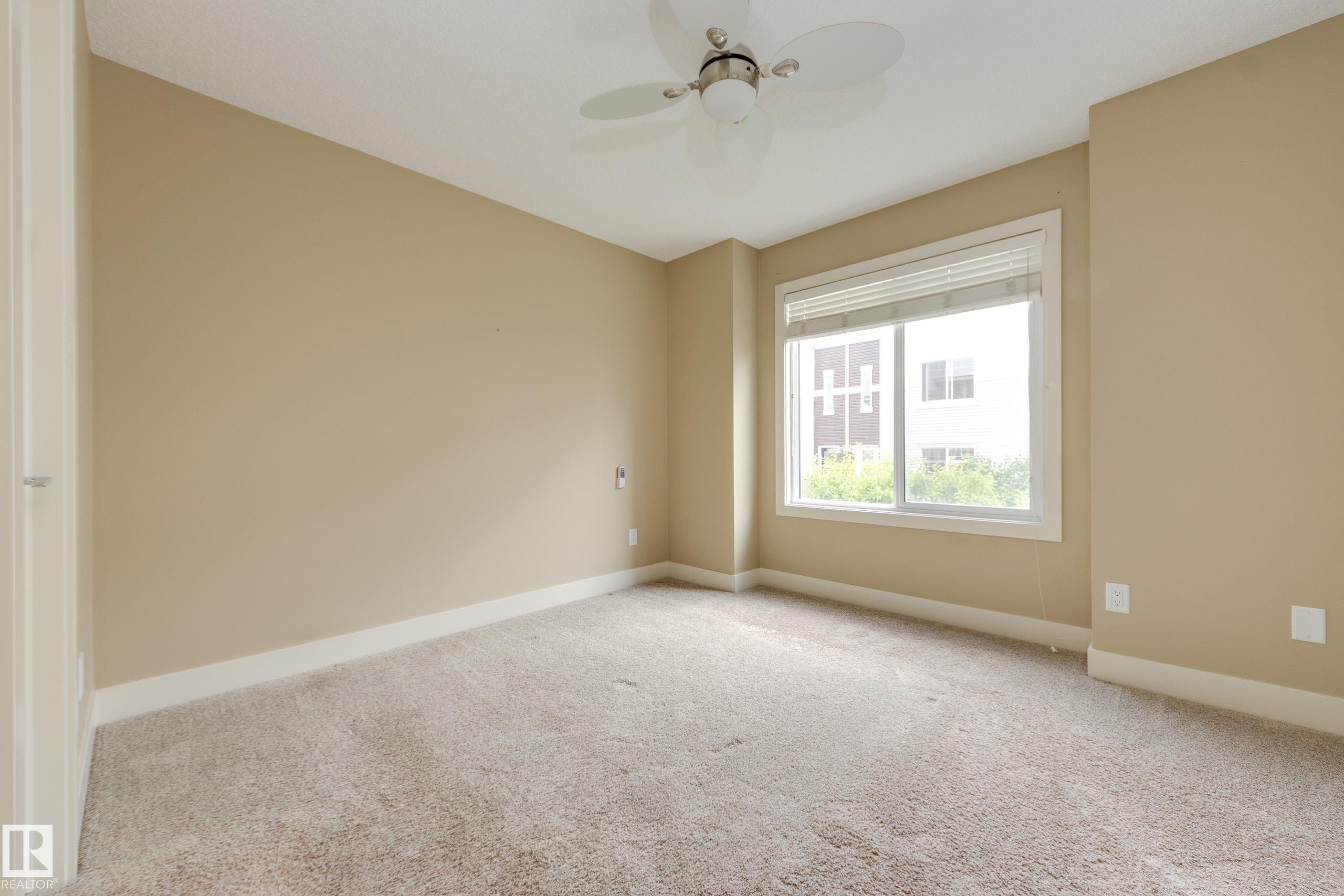 Primary bedroom with walk-in closet - #39 804 Welsh Dr Sw, Edmonton, AB - Indoor Photo Showing Other Room