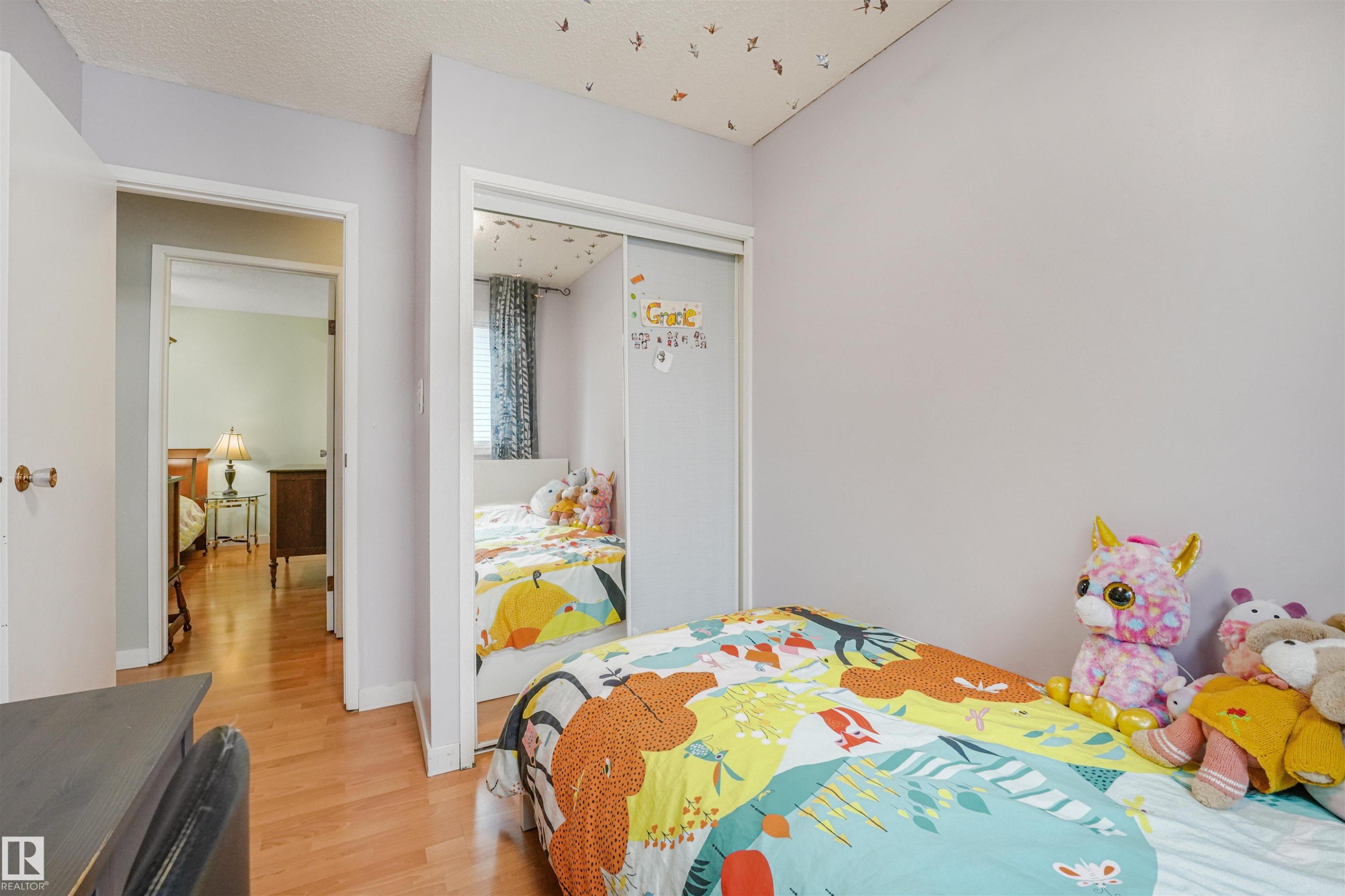 Room featuring light-toned walls and wood-finish flooring - 18611 57 Avenue Nw, Edmonton, AB - Indoor Photo Showing Bedroom