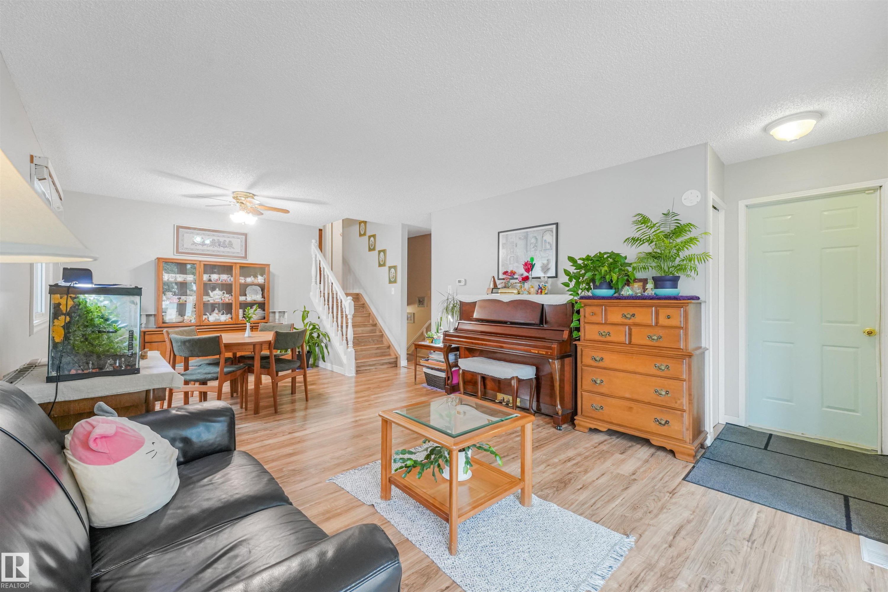 Open-concept living space featuring wood-finish flooring throughout - 18611 57 Avenue Nw, Edmonton, AB - Indoor Photo Showing Living Room