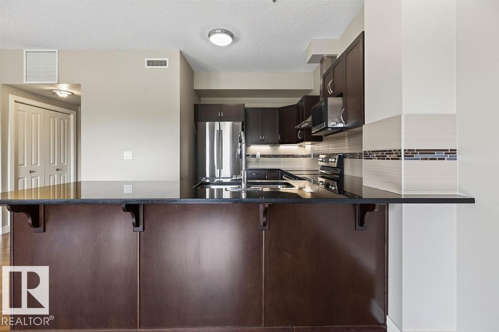 #303 35 Sturgeon Rd, St. Albert, AB - Indoor Photo Showing Kitchen With Stainless Steel Kitchen With Double Sink With Upgraded Kitchen