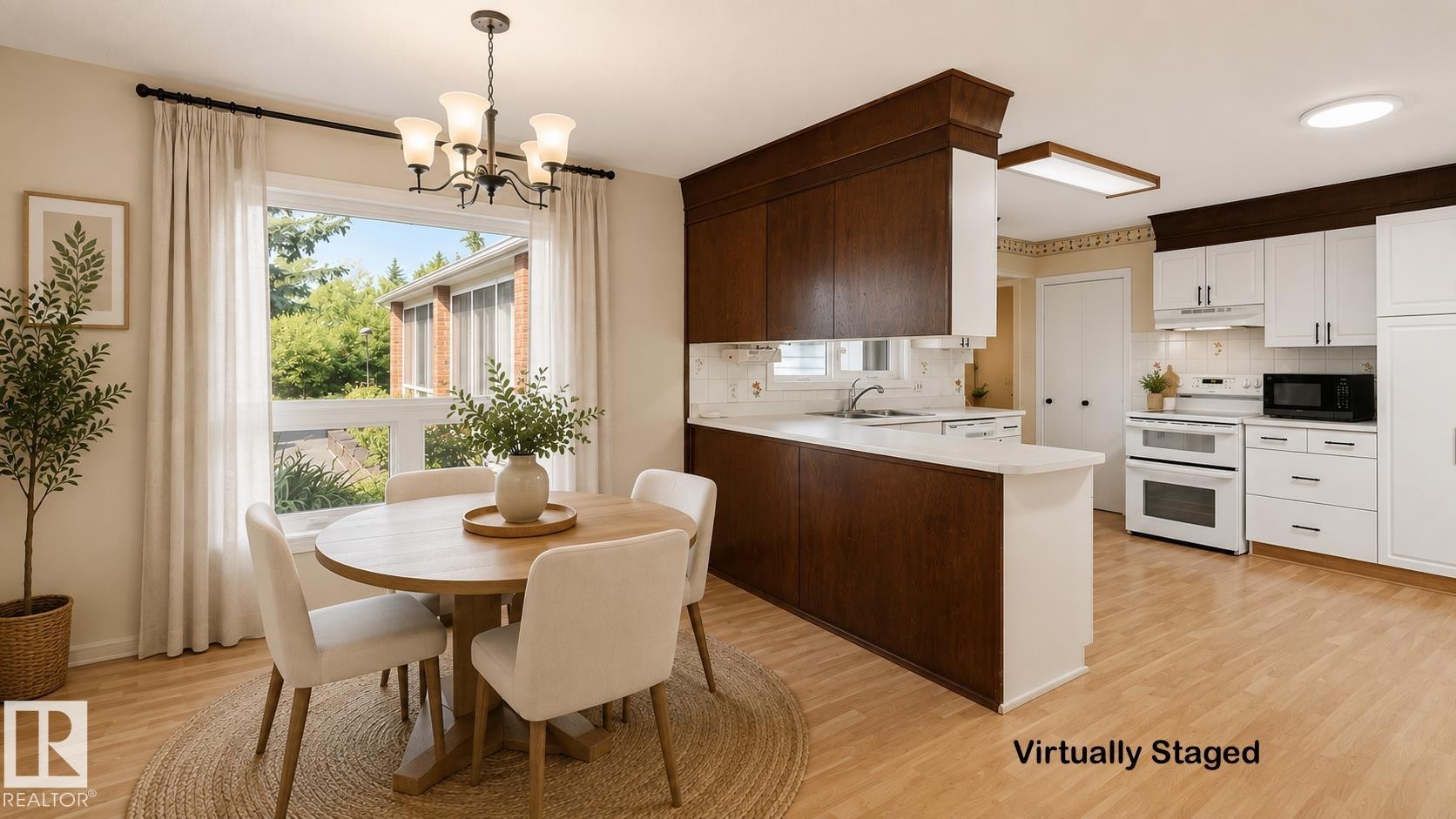 Wood-finish flooring, white upper cabinetry, dark wood-finish lower cabinetry, white appliances, and a window with a chandelier - 8408 176 Street Nw, Edmonton, AB - Indoor
