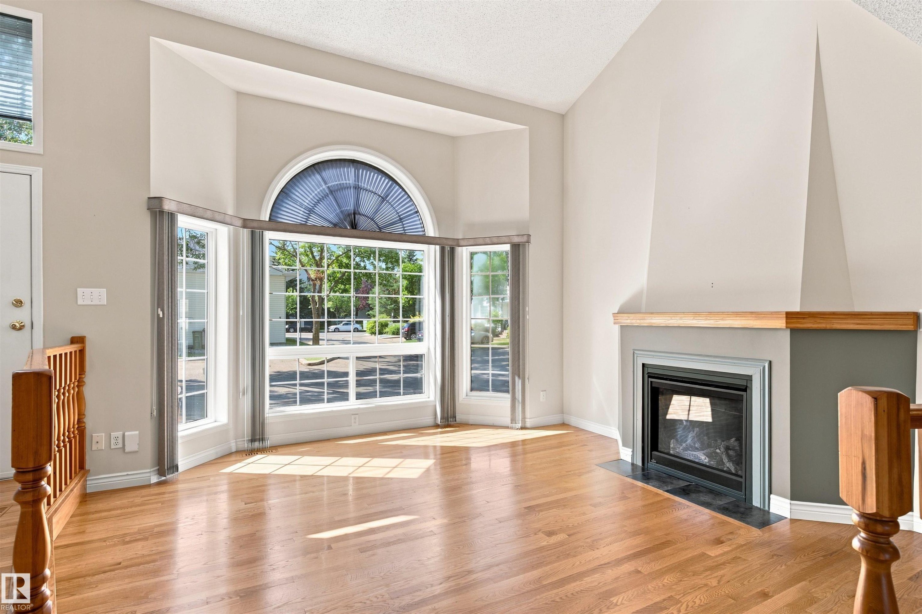 #1 3311 58 St Nw, Edmonton, AB - Indoor Photo Showing Living Room With Fireplace
