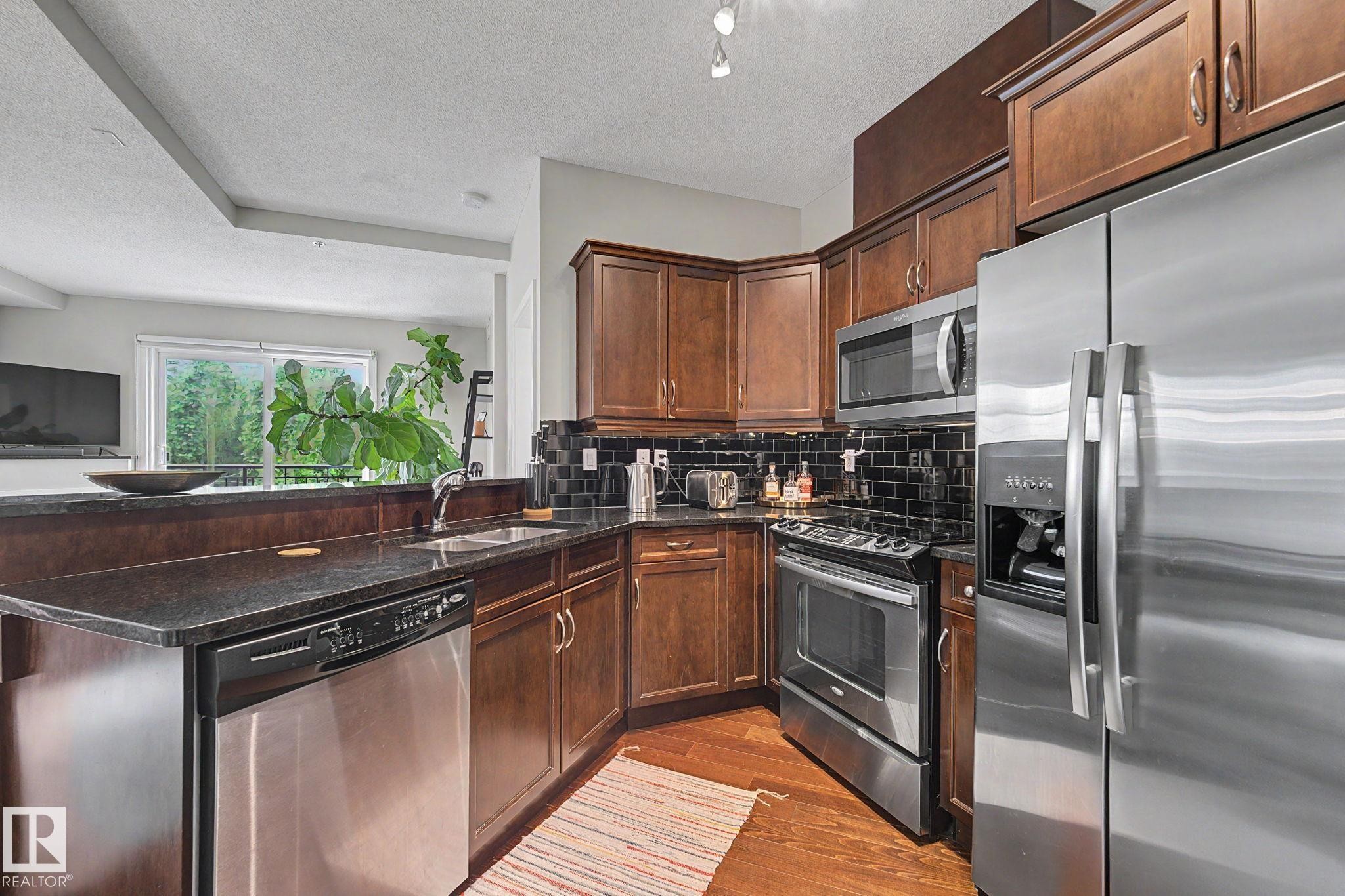 #307 7907 109 St Nw, Edmonton, AB - Indoor Photo Showing Kitchen With Stainless Steel Kitchen With Double Sink