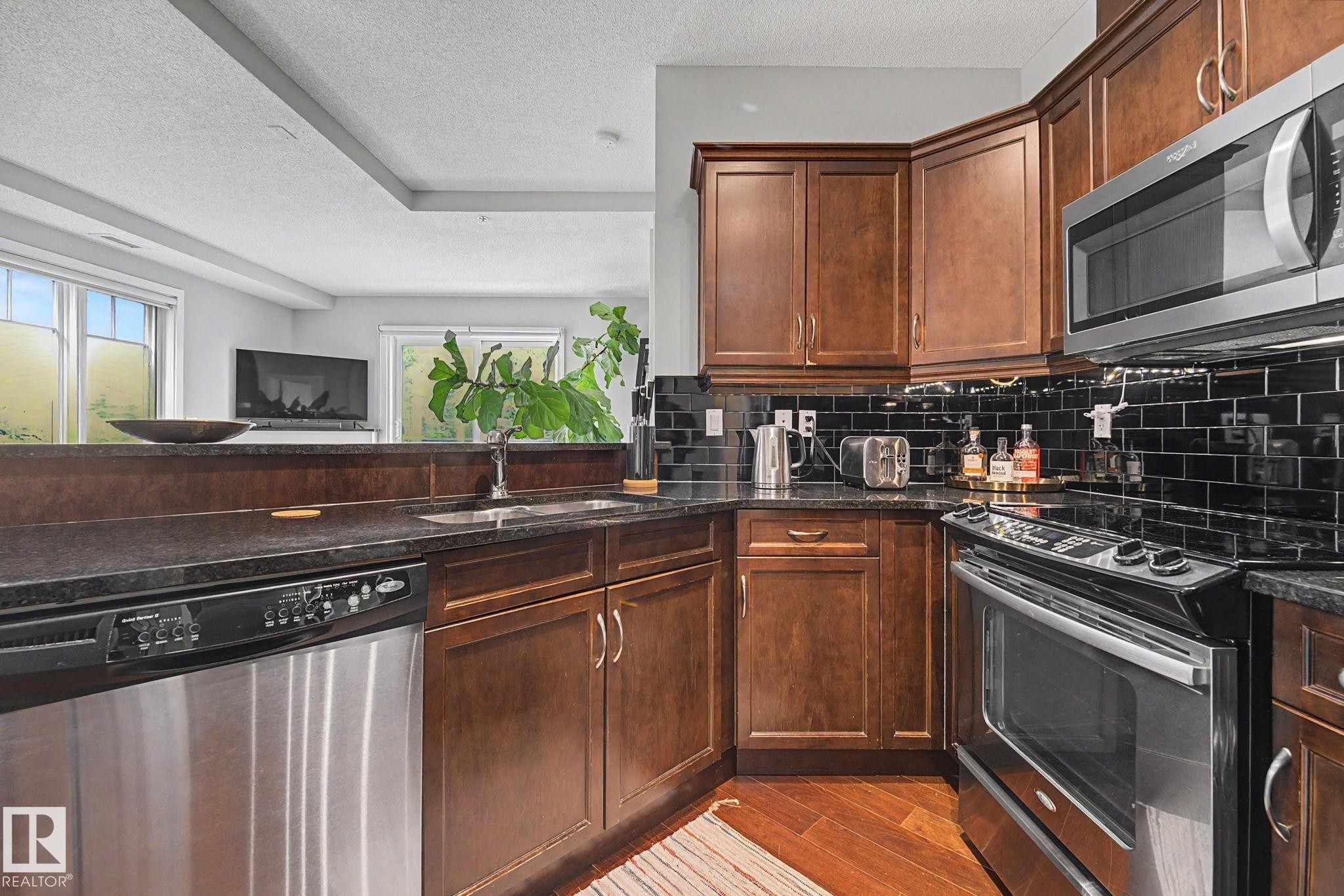 #307 7907 109 St Nw, Edmonton, AB - Indoor Photo Showing Kitchen With Stainless Steel Kitchen