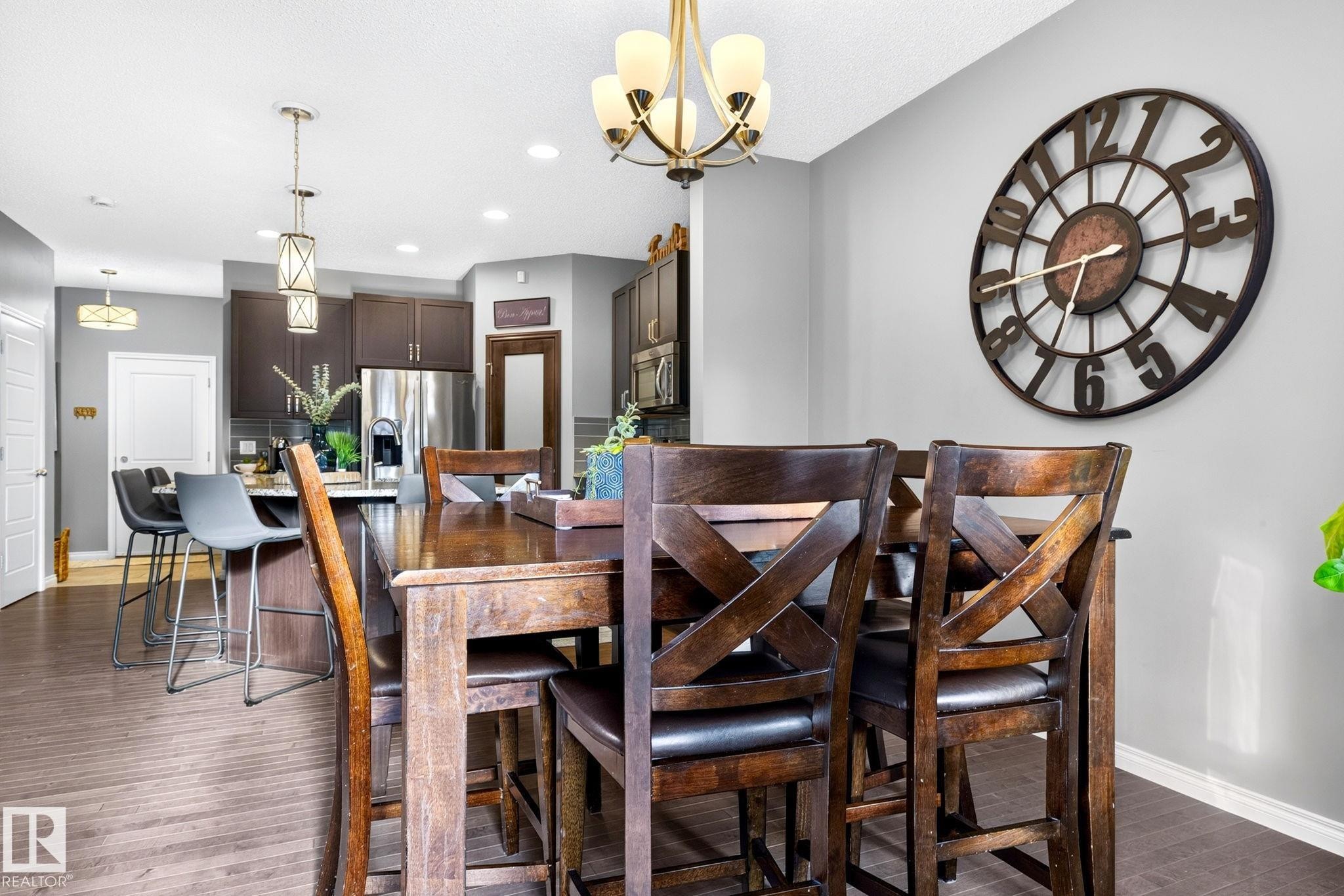 Wood-finish flooring throughout - 16512 140 Street Nw, Edmonton, AB - Indoor Photo Showing Dining Room