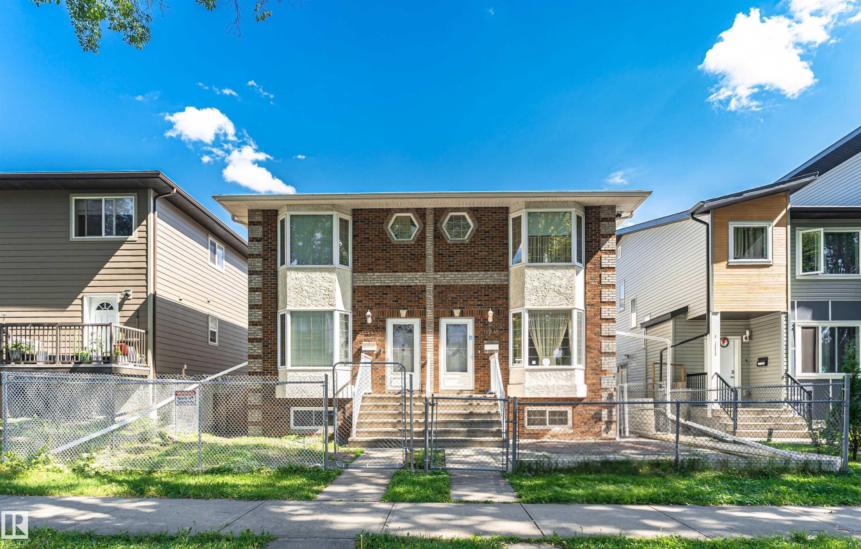 Brick and stucco facade with bay windows and hexagonal accents - 12241 93 Street Nw, Edmonton, AB - Outdoor With Deck Patio Veranda With Facade