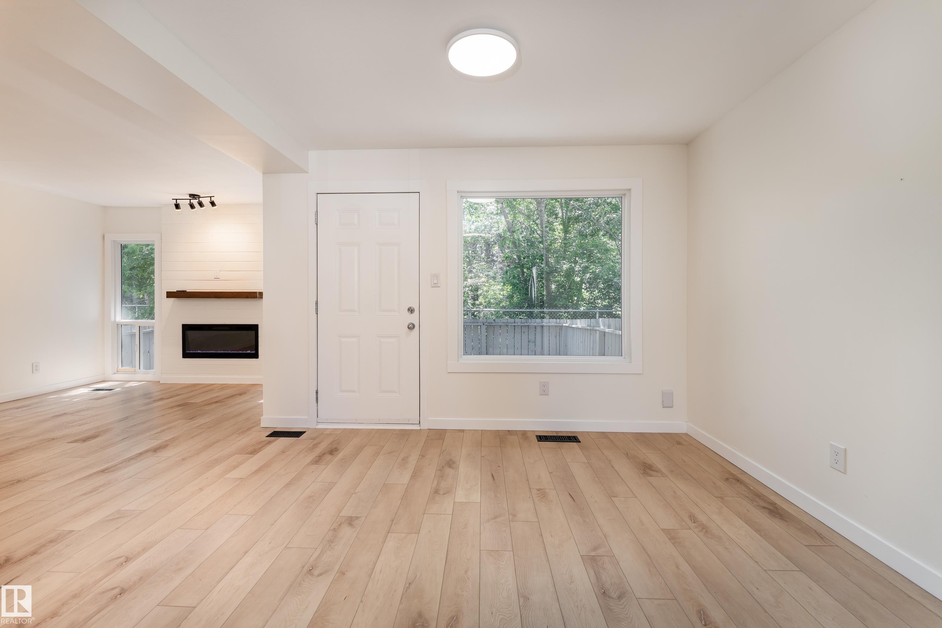 #10 1415 62 St Nw, Edmonton, AB - Indoor Photo Showing Other Room With Fireplace