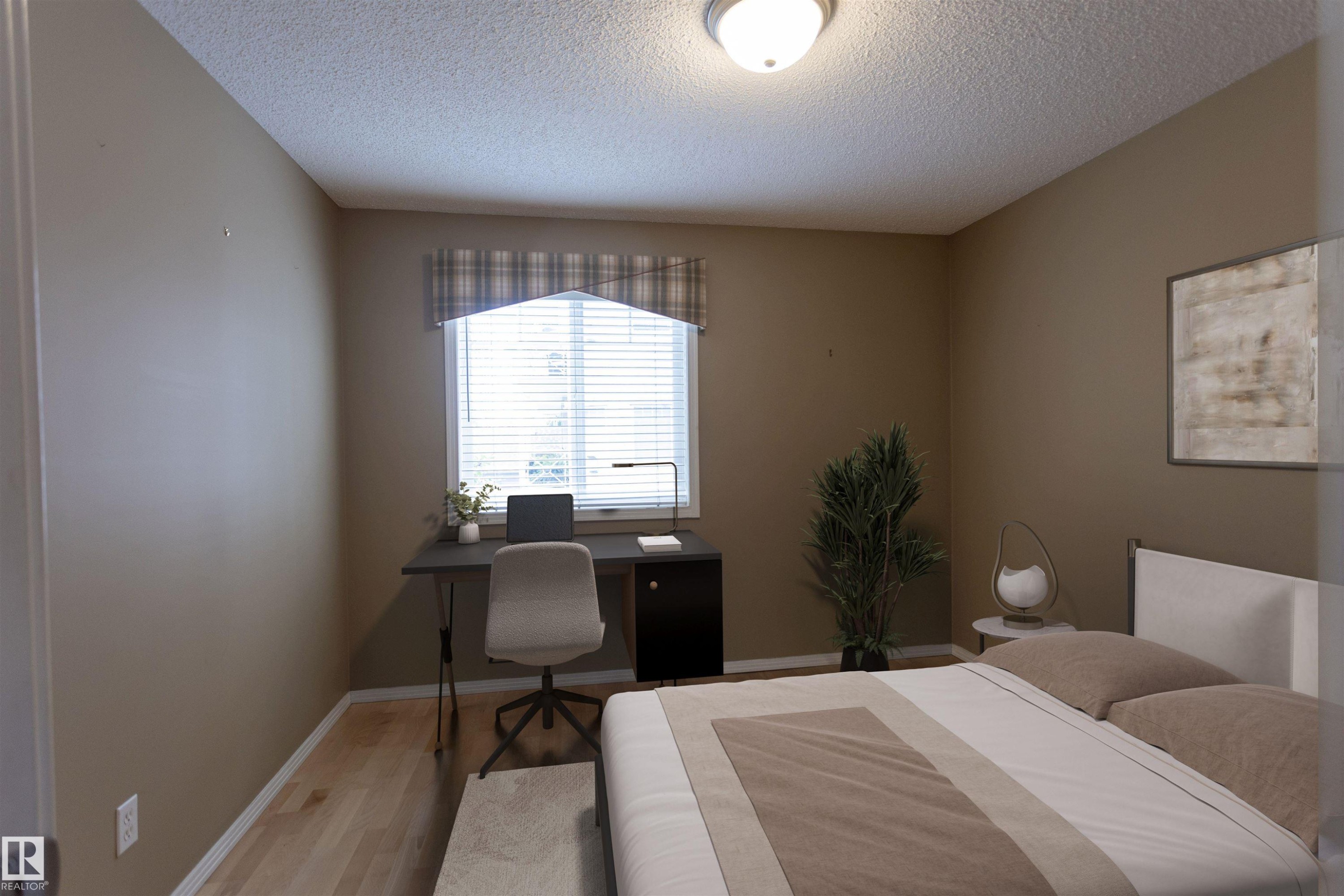 Recessed window with blinds and valance, wood-finish flooring, and ceiling-mounted light fixture - #204 2420 108 St Nw, Edmonton, AB