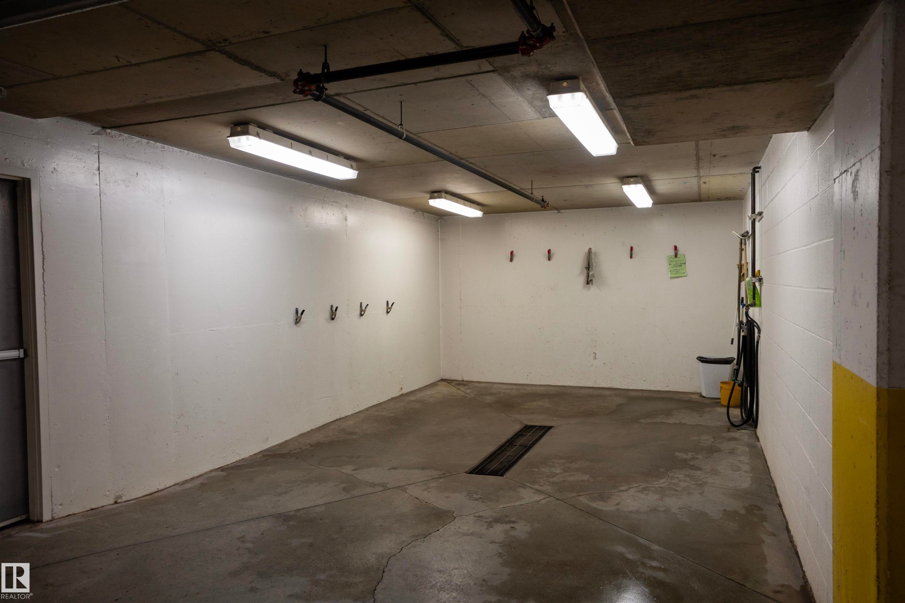 Concrete flooring with integrated drainage system - #204 2420 108 St Nw, Edmonton, AB