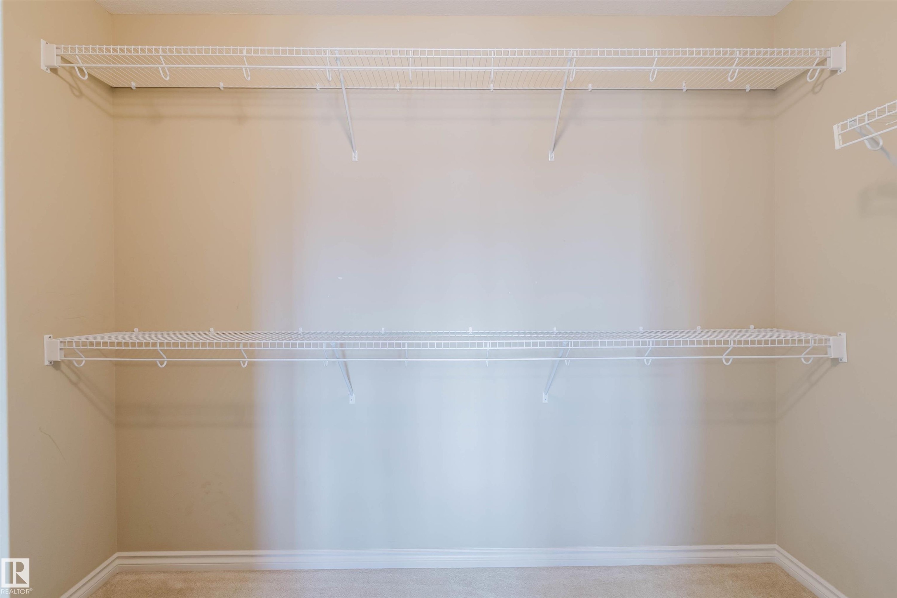 Built-in wire shelving system with multiple tiers - 864 Armitage Wynd Sw, Edmonton, AB - Indoor With Storage