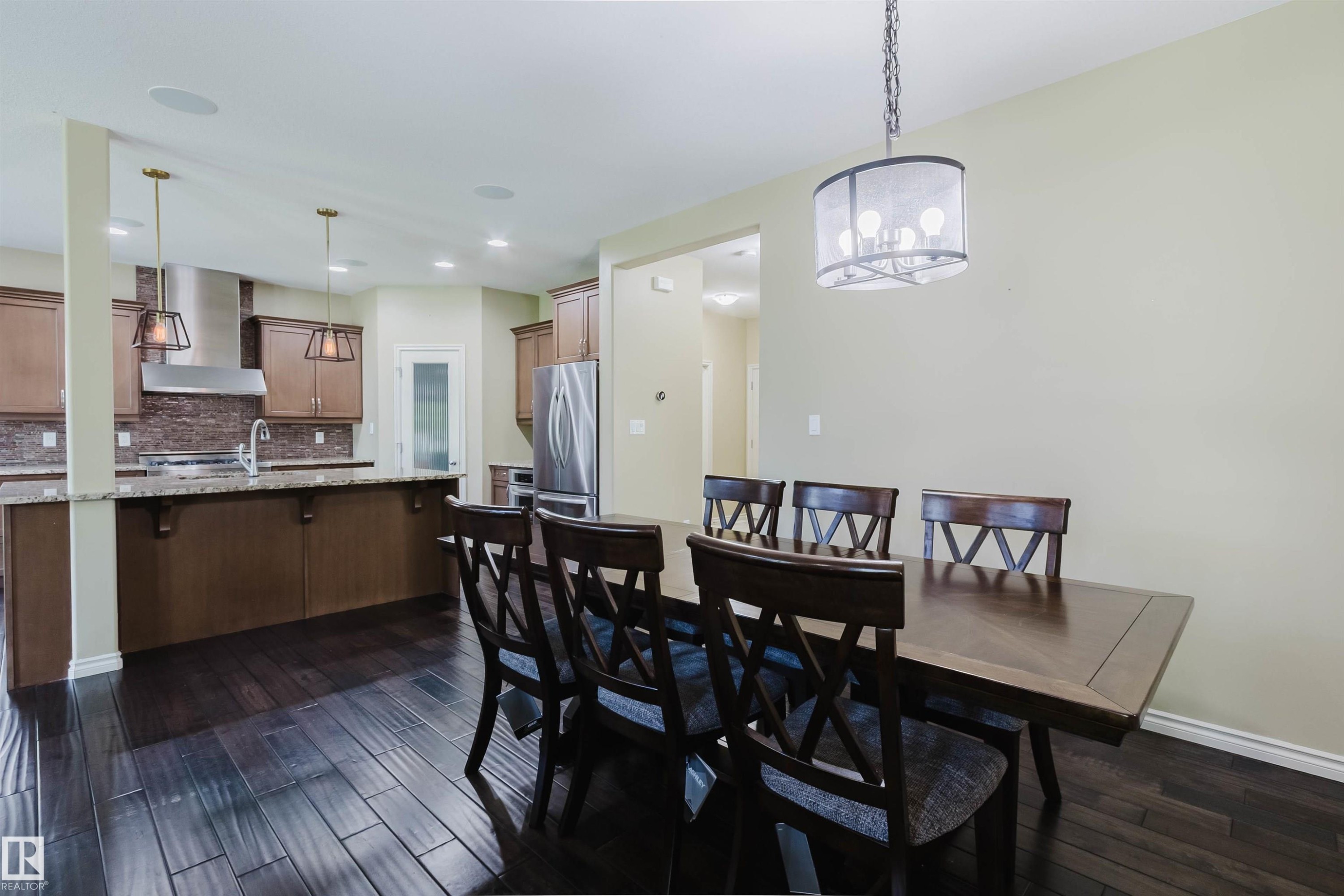 Hardwood-style flooring throughout - 864 Armitage Wynd Sw, Edmonton, AB - Indoor Photo Showing Other Room