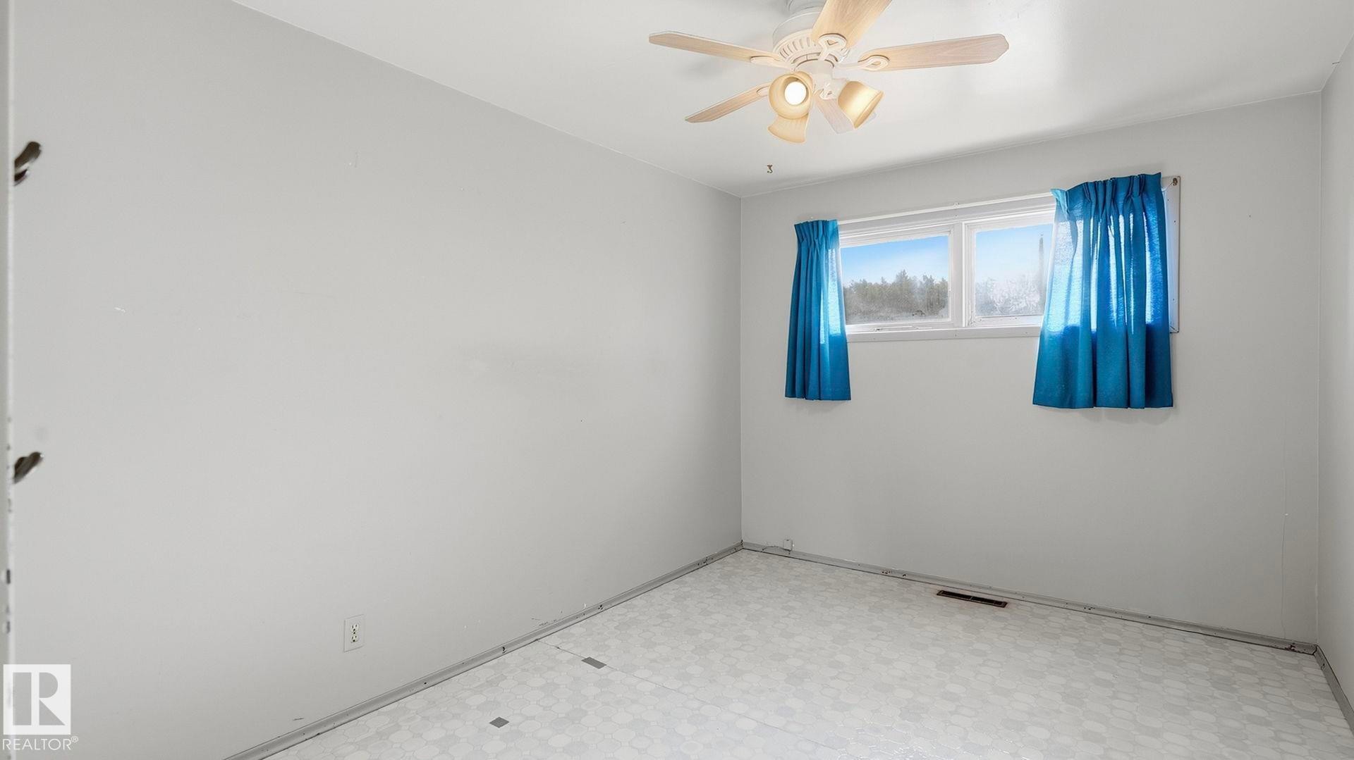 Recessed lighting, ceiling fan, and window with natural light - 52012 Hwy 21, Rural Strathcona County, AB - Indoor Photo Showing Other Room