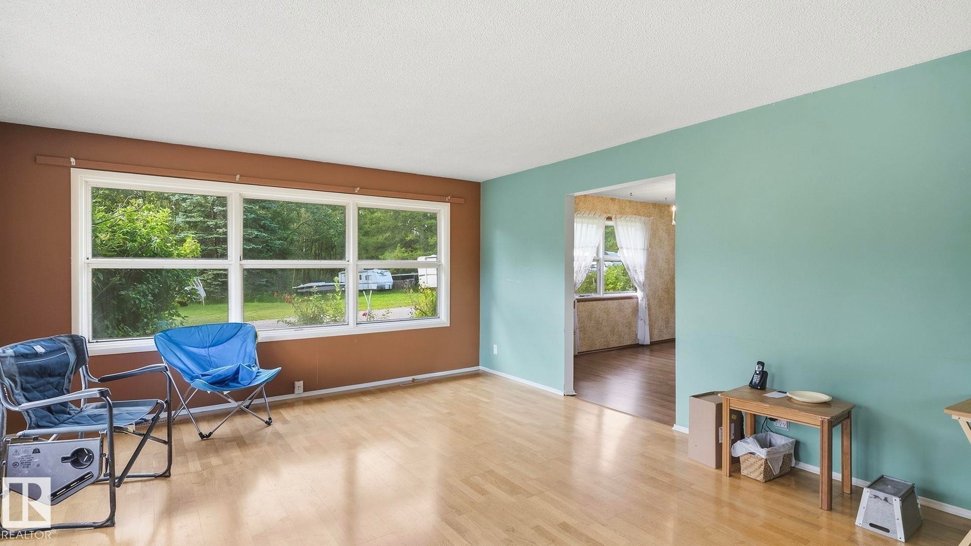 Light wood-finish flooring with a white ceiling - 52012 Hwy 21, Rural Strathcona County, AB - Indoor