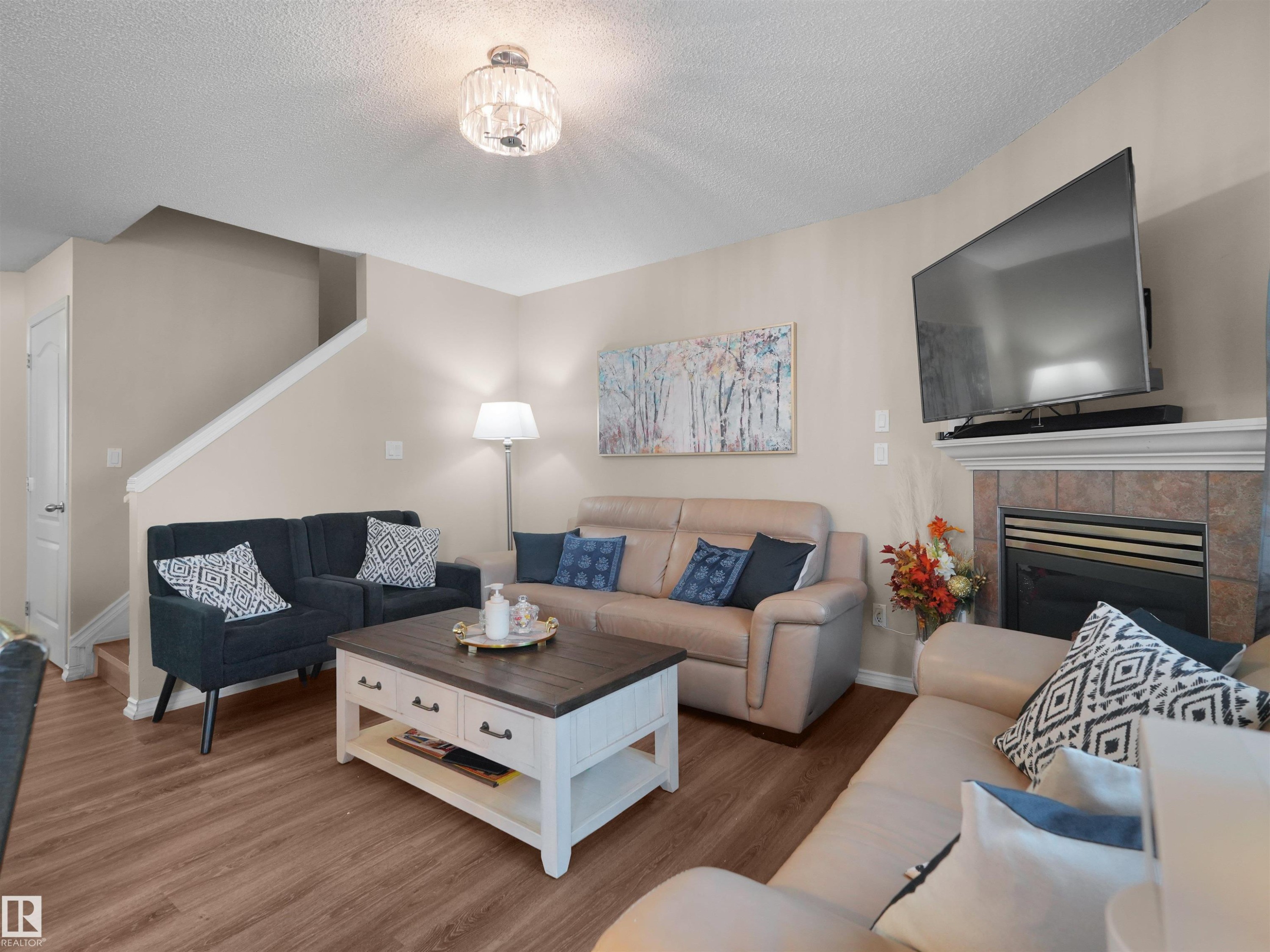 #90 5001 62 St, Beaumont, AB - Indoor Photo Showing Living Room With Fireplace