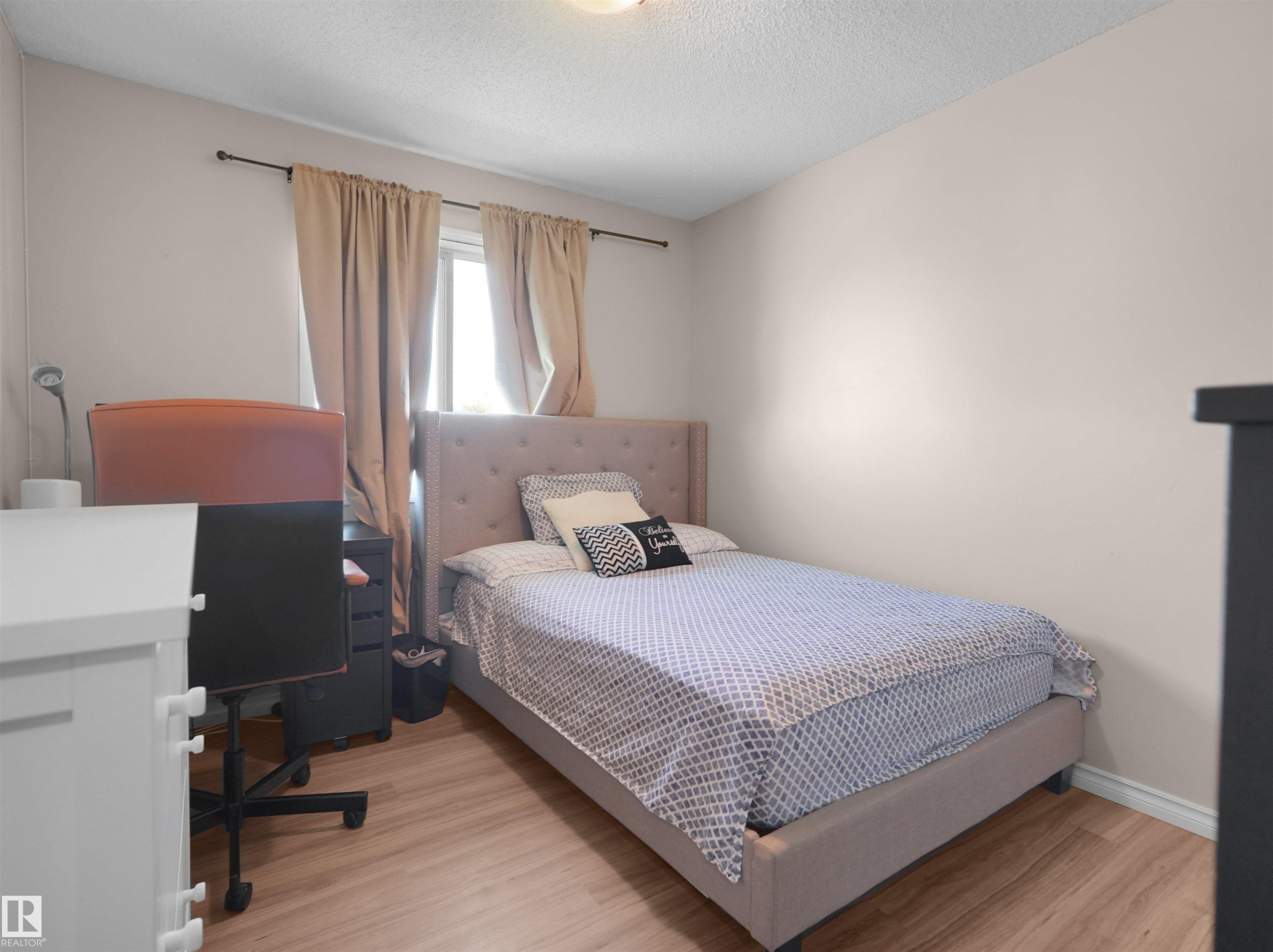 #90 5001 62 St, Beaumont, AB - Indoor Photo Showing Bedroom