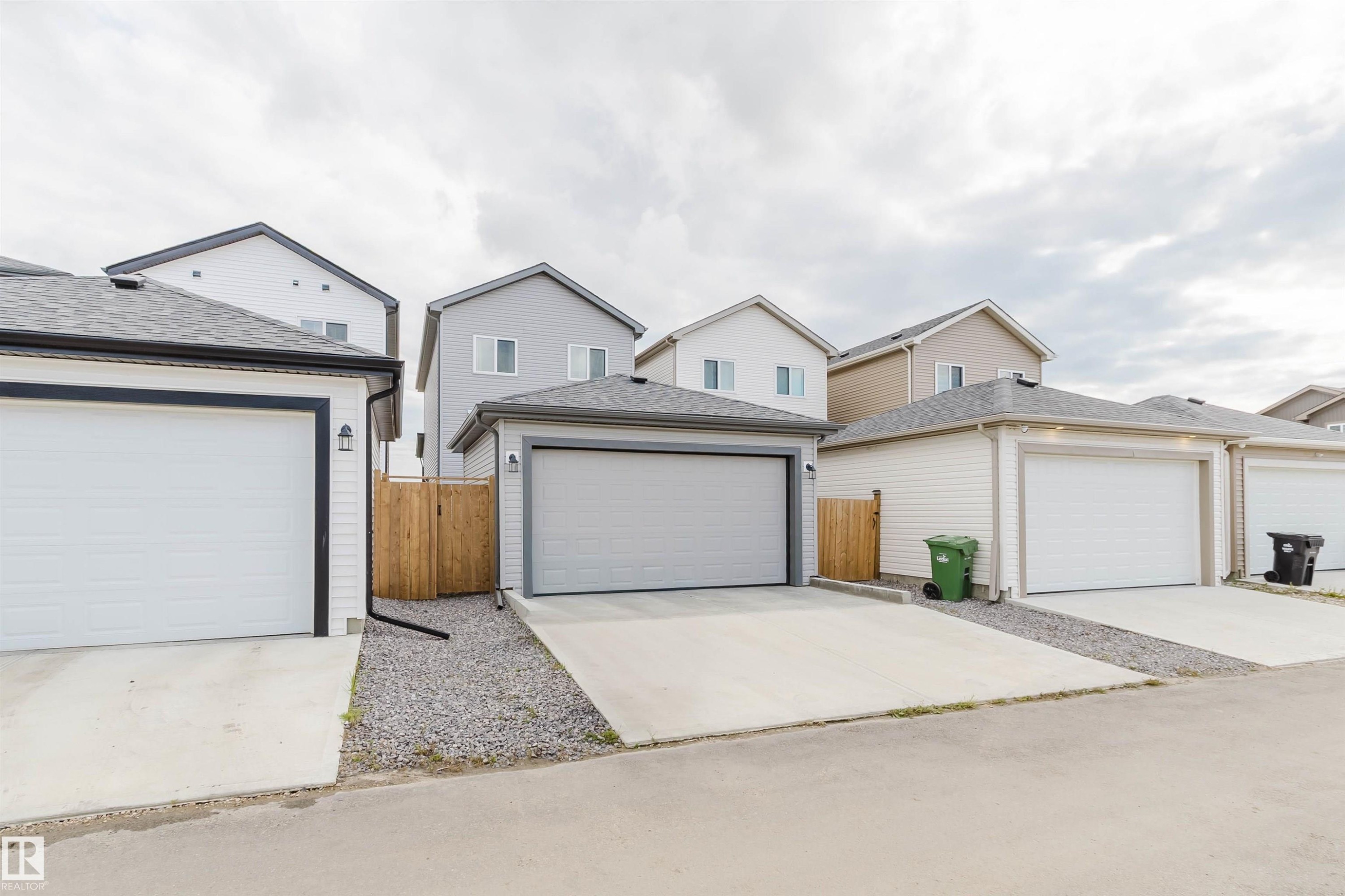 Detached garage with a concrete driveway - 104 Meadowview Way, Leduc, AB - Outdoor