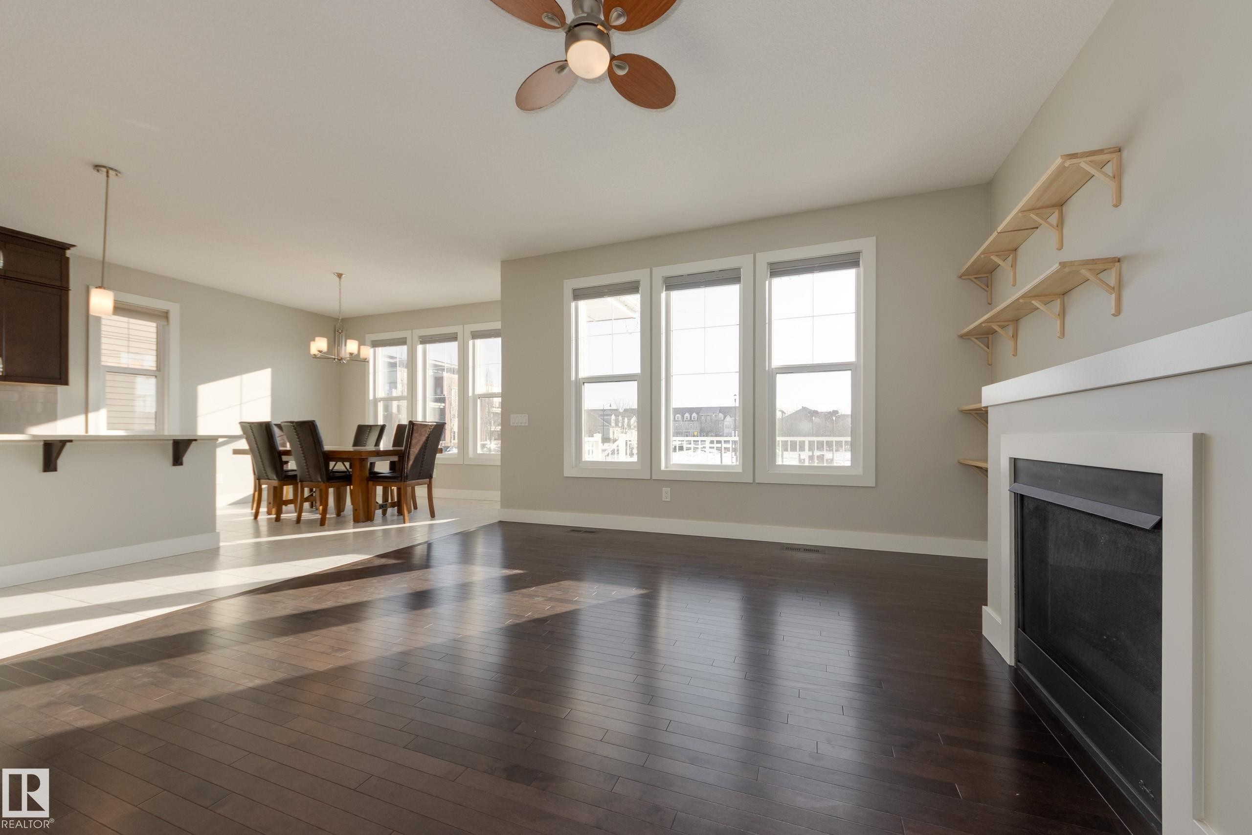 7473 Colonel Mewburn Road Nw, Edmonton, AB - Indoor Photo Showing Other Room With Fireplace