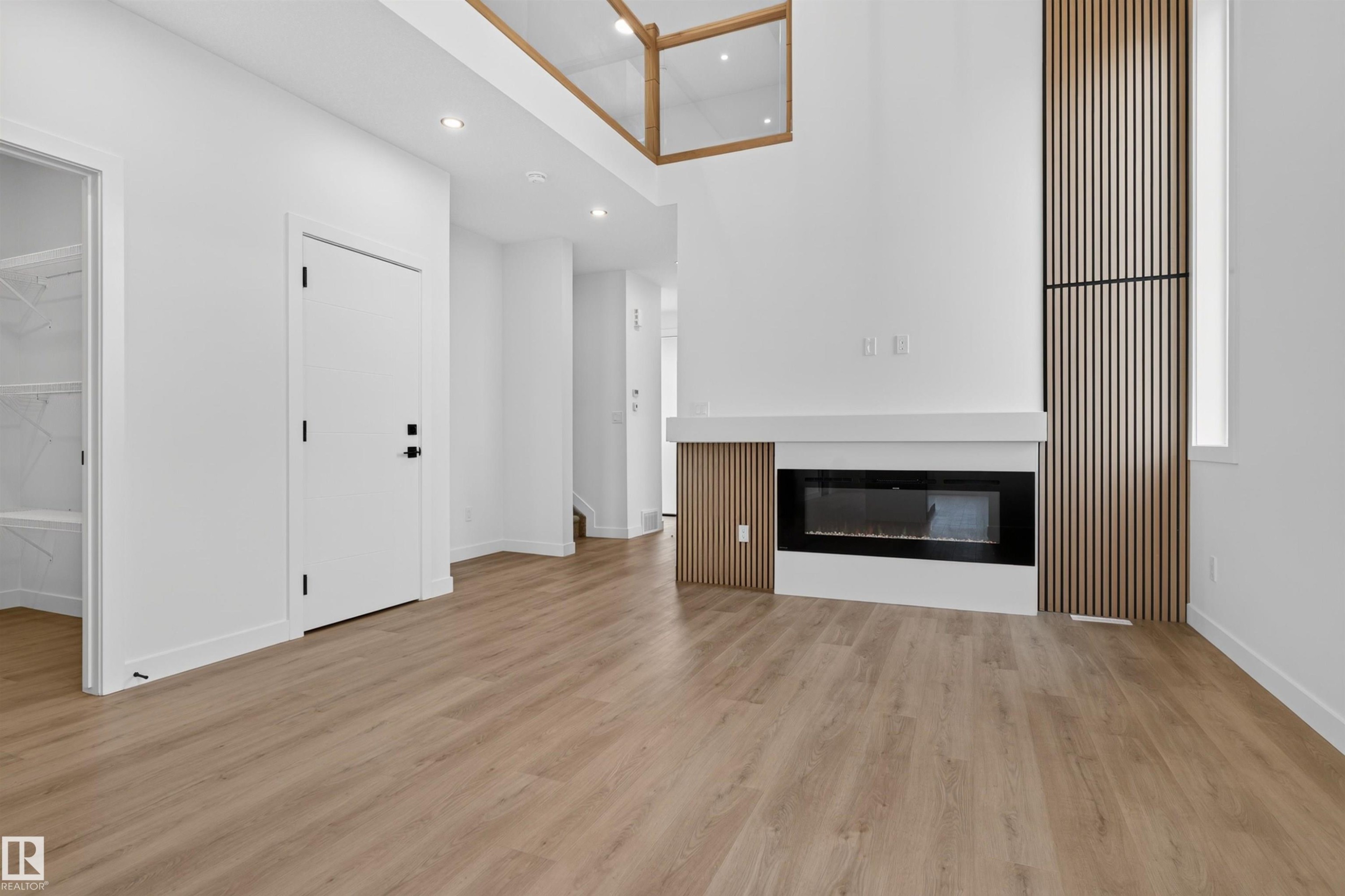 1911 48 St Sw, Edmonton, AB - Indoor Photo Showing Other Room With Fireplace