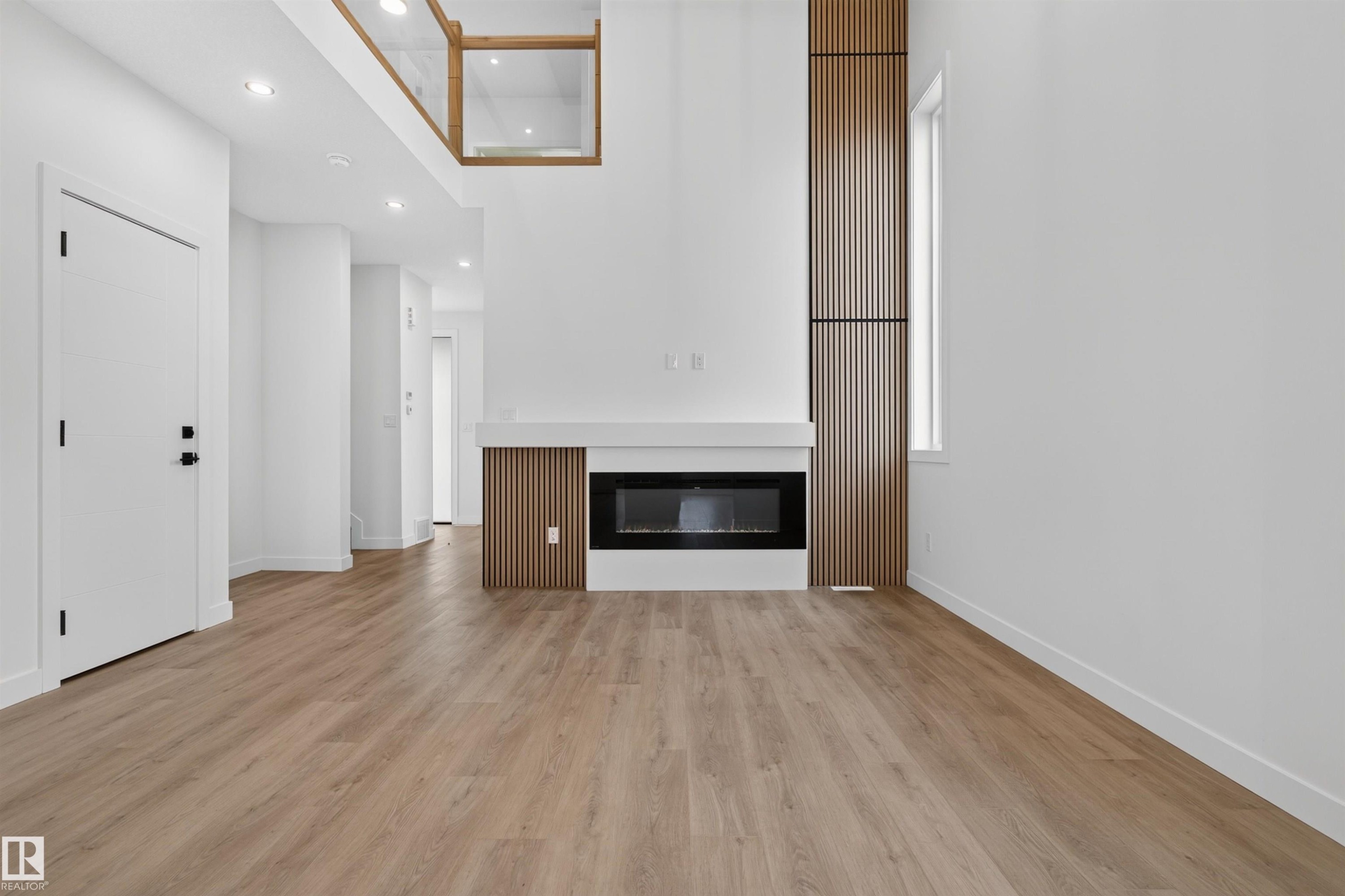 1911 48 St Sw, Edmonton, AB - Indoor Photo Showing Other Room With Fireplace