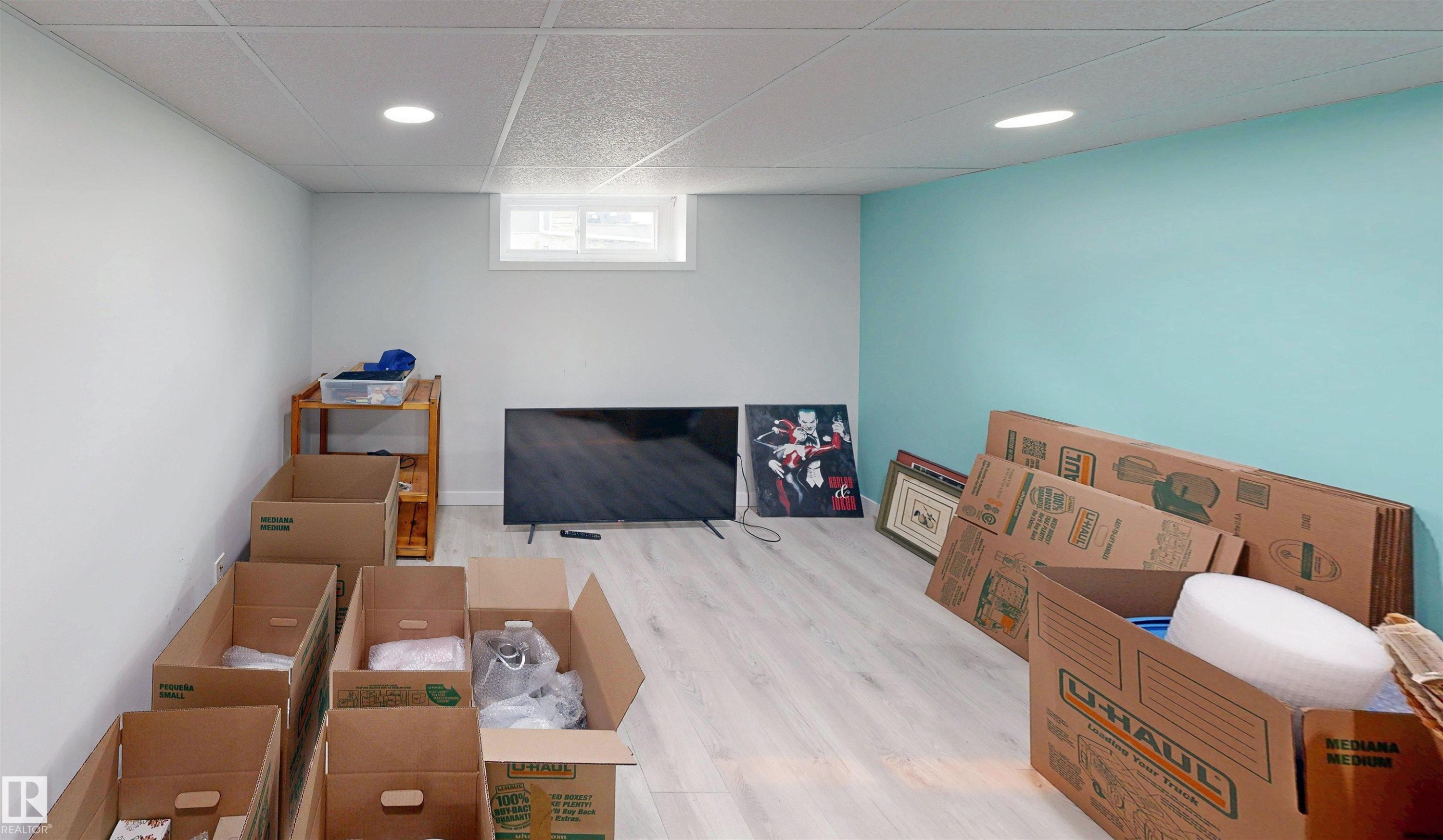 Recessed lighting throughout, drop ceiling, and wood-finish flooring - 9531 74 Street Nw, Edmonton, AB - Indoor Photo Showing Basement