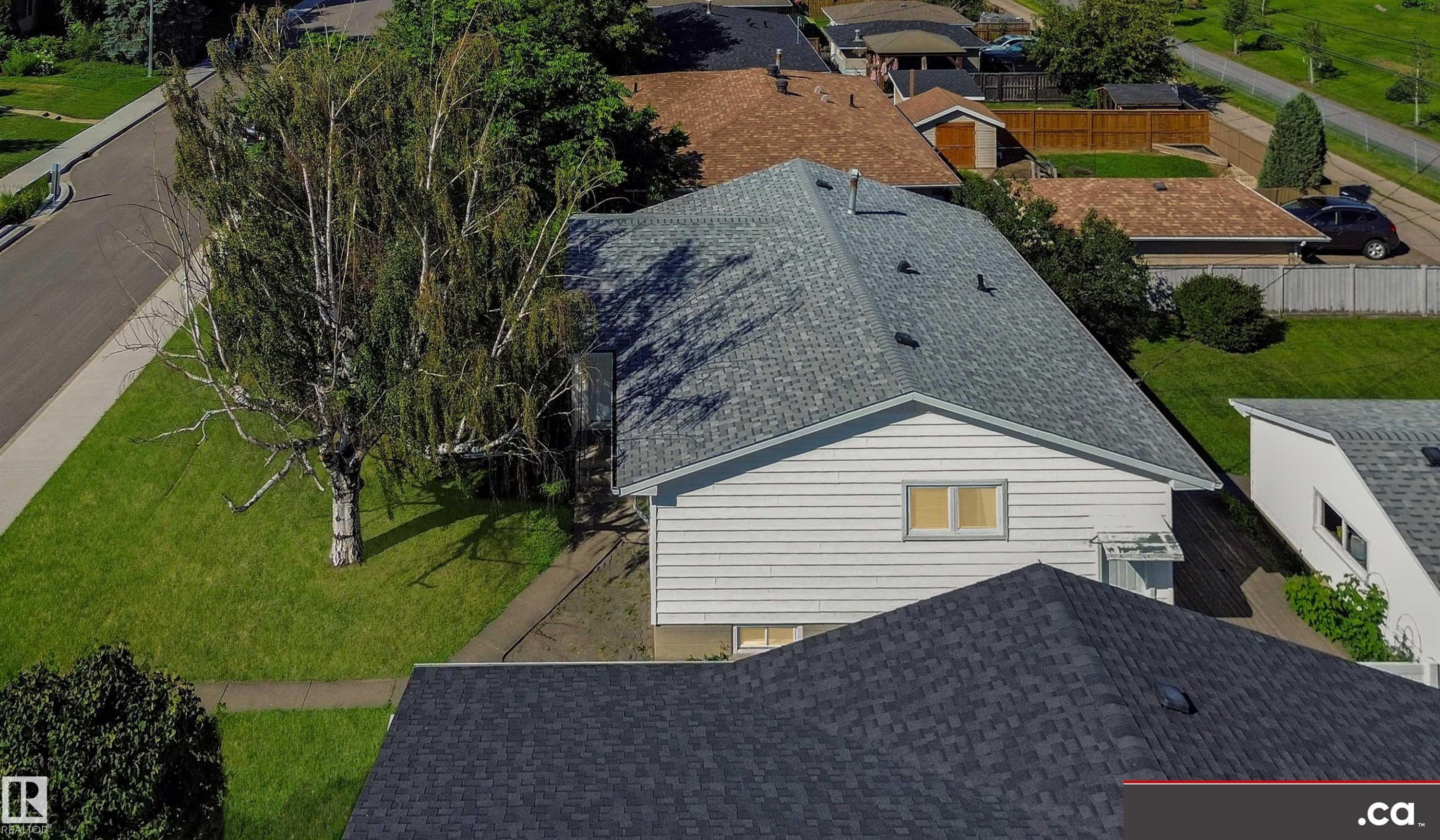 White siding exterior with a light grey shingle roof - 9531 74 Street Nw, Edmonton, AB - Outdoor