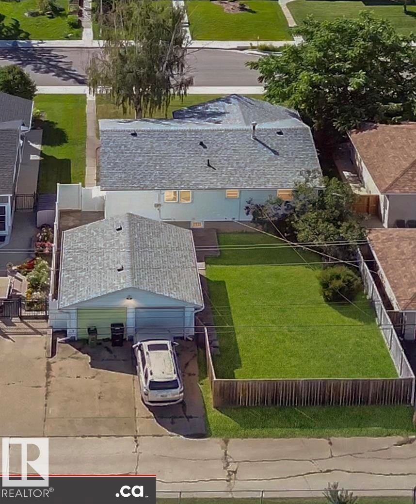 Attached garage with a paved driveway - 9531 74 Street Nw, Edmonton, AB - Outdoor With Deck Patio Veranda