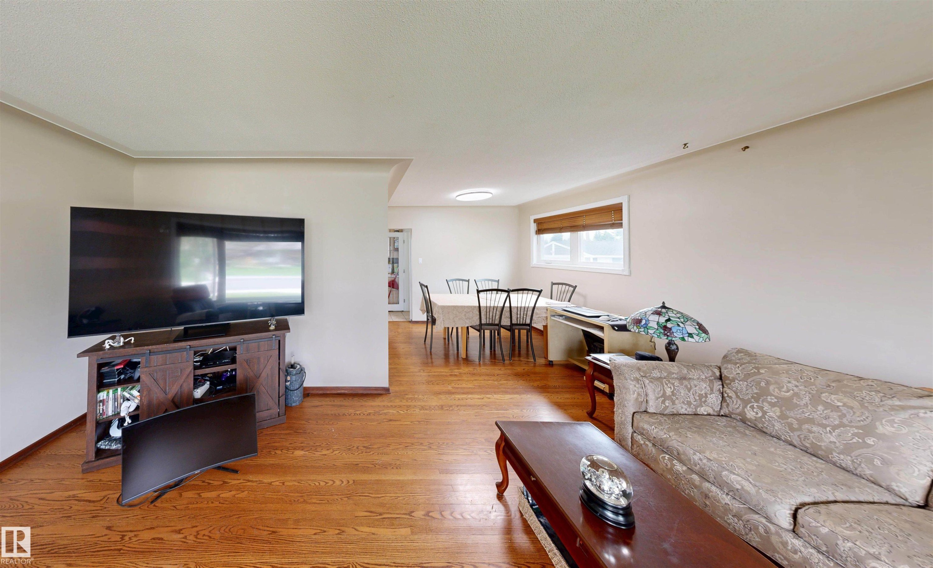 Hardwood flooring throughout, recessed lighting, and an open-concept layout - 9531 74 Street Nw, Edmonton, AB - Indoor Photo Showing Living Room