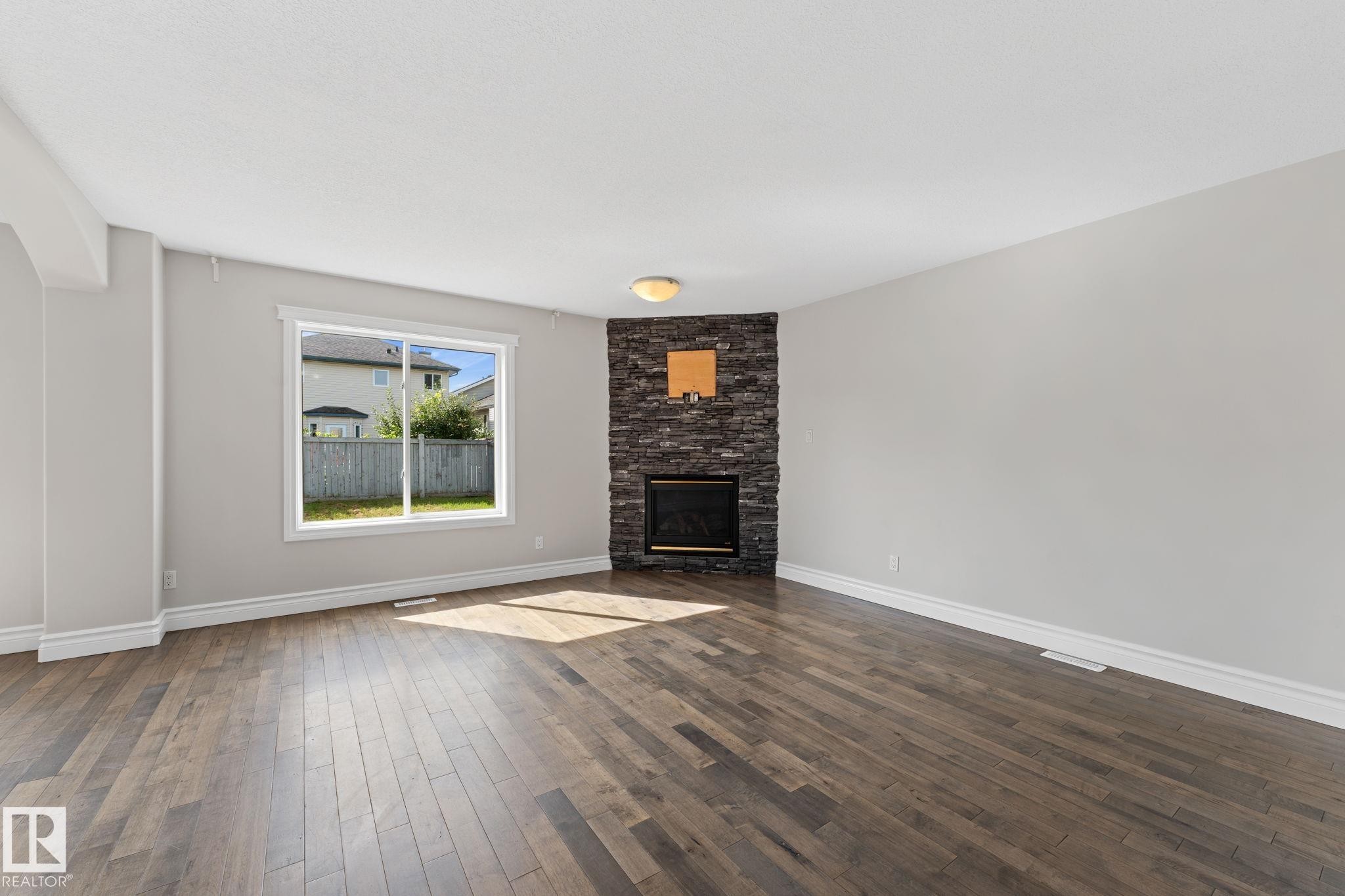 173 Castle Drive Nw, Edmonton, AB - Indoor Photo Showing Living Room With Fireplace