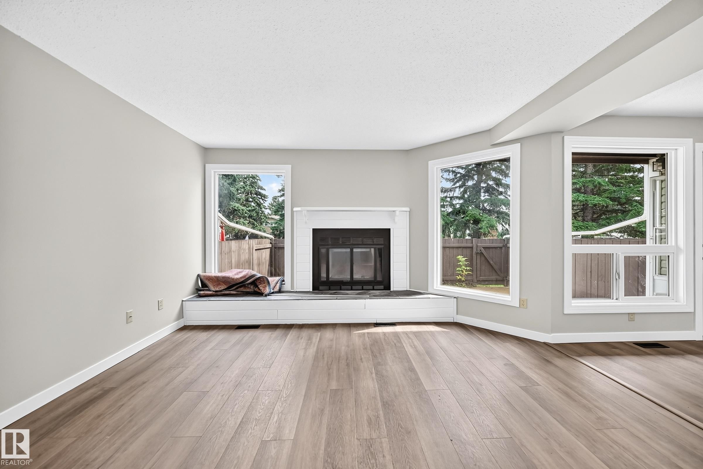 #6 1820 56 St Nw, Edmonton, AB - Indoor Photo Showing Living Room With Fireplace