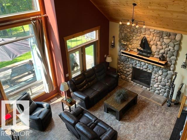 115 Sunset Boulevard, Rural Leduc County, AB - Indoor Photo Showing Living Room With Fireplace