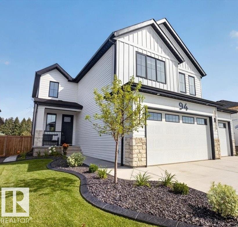 Contemporary exterior featuring white siding and black trim - 94 Harvest Crescent, Ardrossan, AB - Outdoor