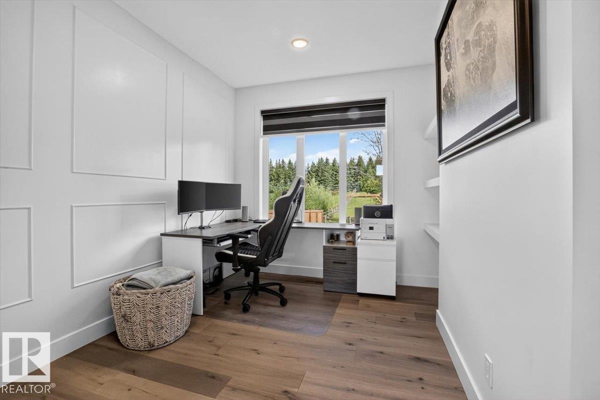 Hardwood-style flooring, window with exterior landscape, recessed lighting, and built-in shelving - 94 Harvest Crescent, Ardrossan, AB - Indoor Photo Showing Office