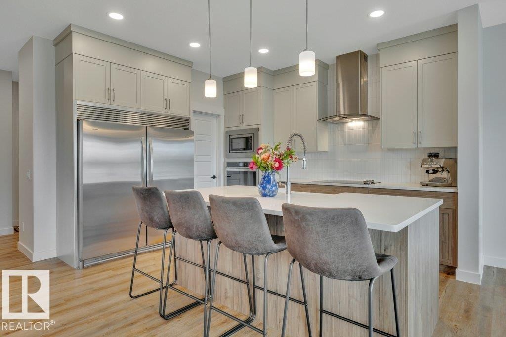 With stainless steel appliances (including side-by-side fridge/freezer) - 5329 Lark Landing Nw, Edmonton, AB - Indoor Photo Showing Kitchen With Upgraded Kitchen