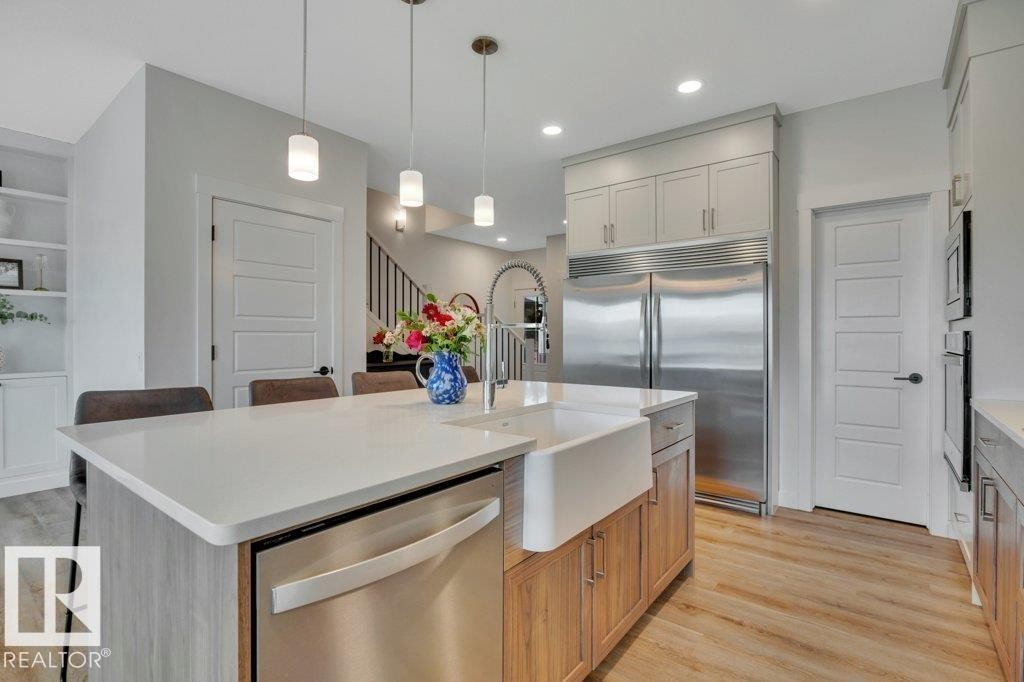 With corner pantry - 5329 Lark Landing Nw, Edmonton, AB - Indoor Photo Showing Kitchen With Upgraded Kitchen