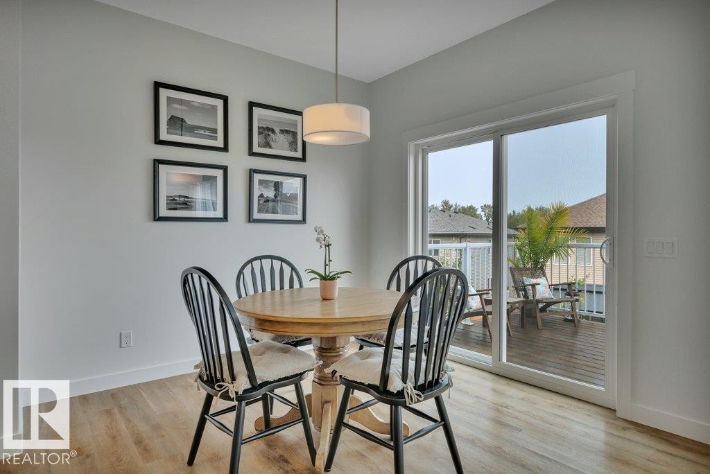 Overlooking deck with BBQ (included) - 5329 Lark Landing Nw, Edmonton, AB - Indoor Photo Showing Dining Room