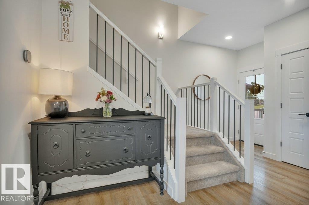 Leading to second floor - 5329 Lark Landing Nw, Edmonton, AB - Indoor Photo Showing Other Room