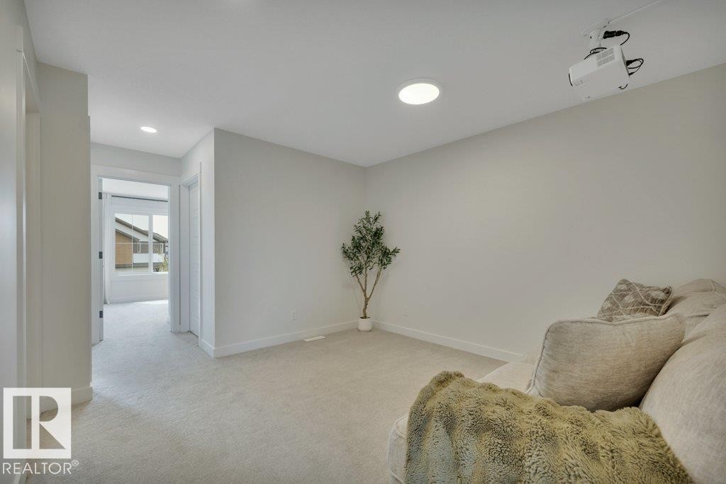 With projector - 5329 Lark Landing Nw, Edmonton, AB - Indoor Photo Showing Other Room