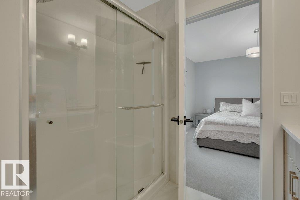 Looking to primary bedroom - 5329 Lark Landing Nw, Edmonton, AB - Indoor Photo Showing Bathroom
