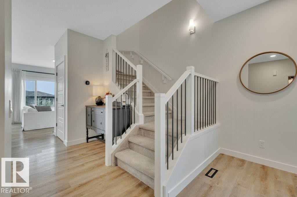 With a view to great room - 5329 Lark Landing Nw, Edmonton, AB - Indoor Photo Showing Other Room