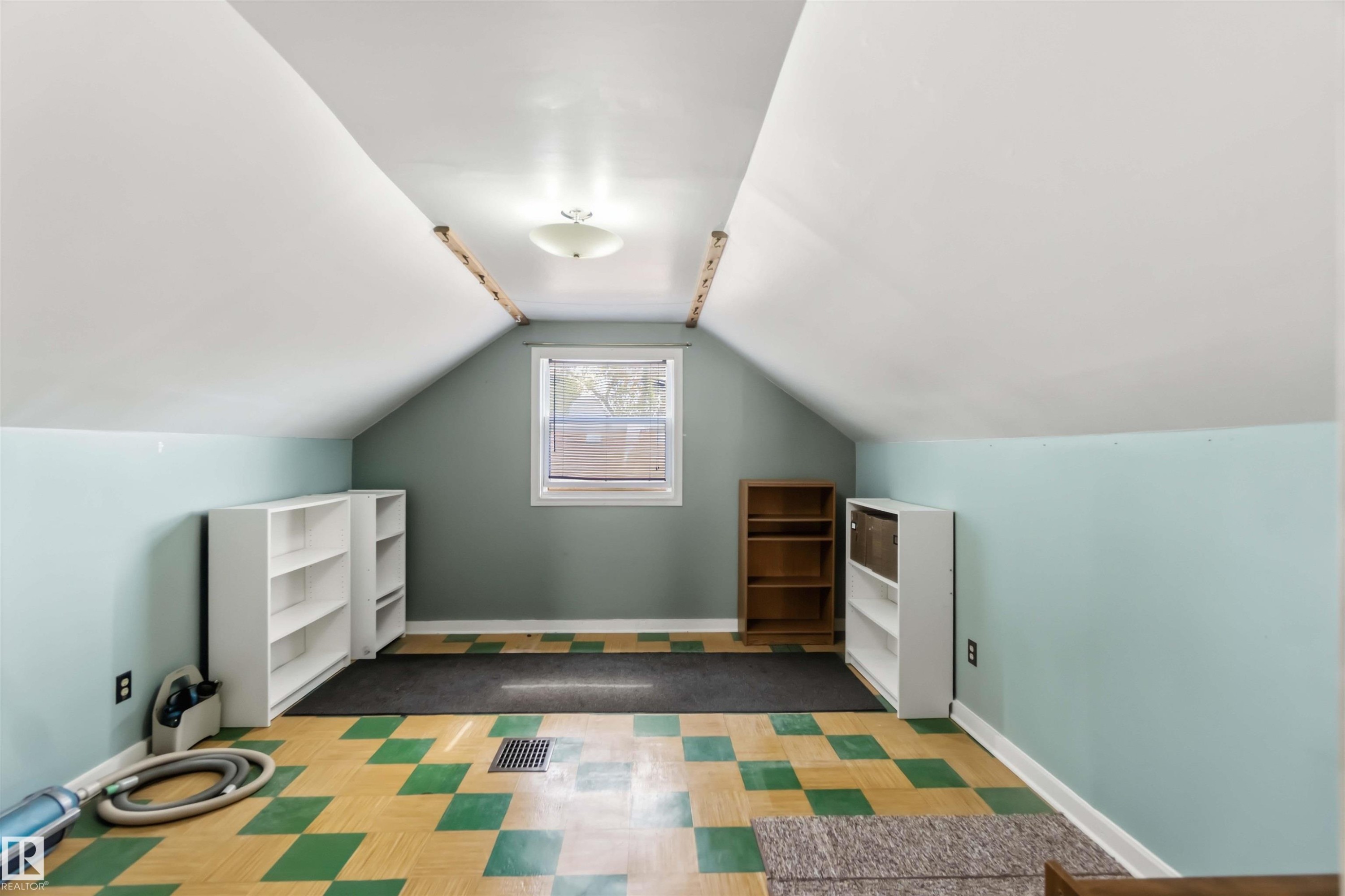 Sloped ceilings with recessed lighting, central window, and patterned flooring - 11710 94 Street Nw, Edmonton, AB - Indoor Photo Showing Other Room